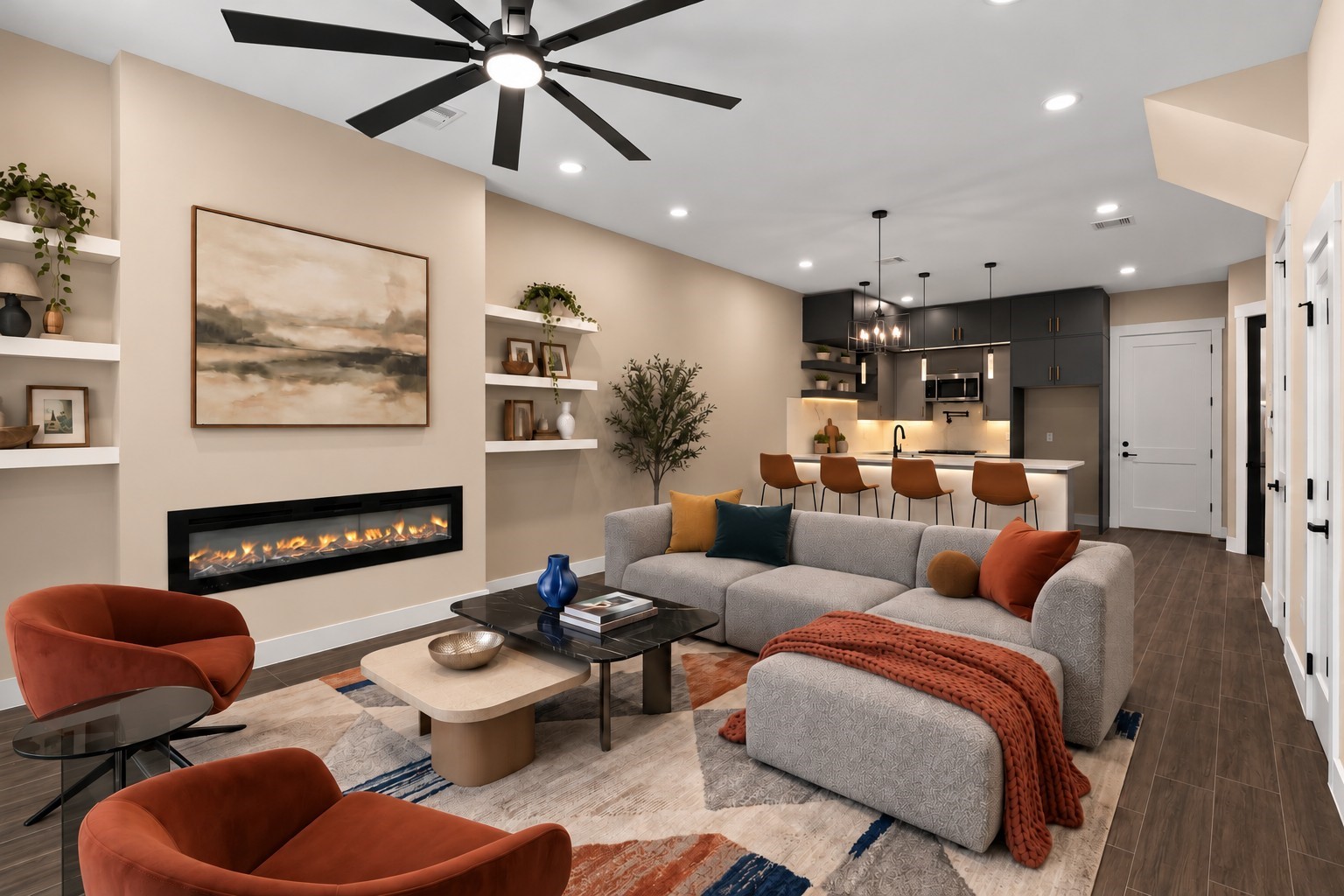 Virtually Staged: Offering a warm and inviting footprint, this main living area highlights clean architectural lines and integrated features. Built-in display shelving frames a ribbon fireplace, adding sophisticated style to the main seating area.