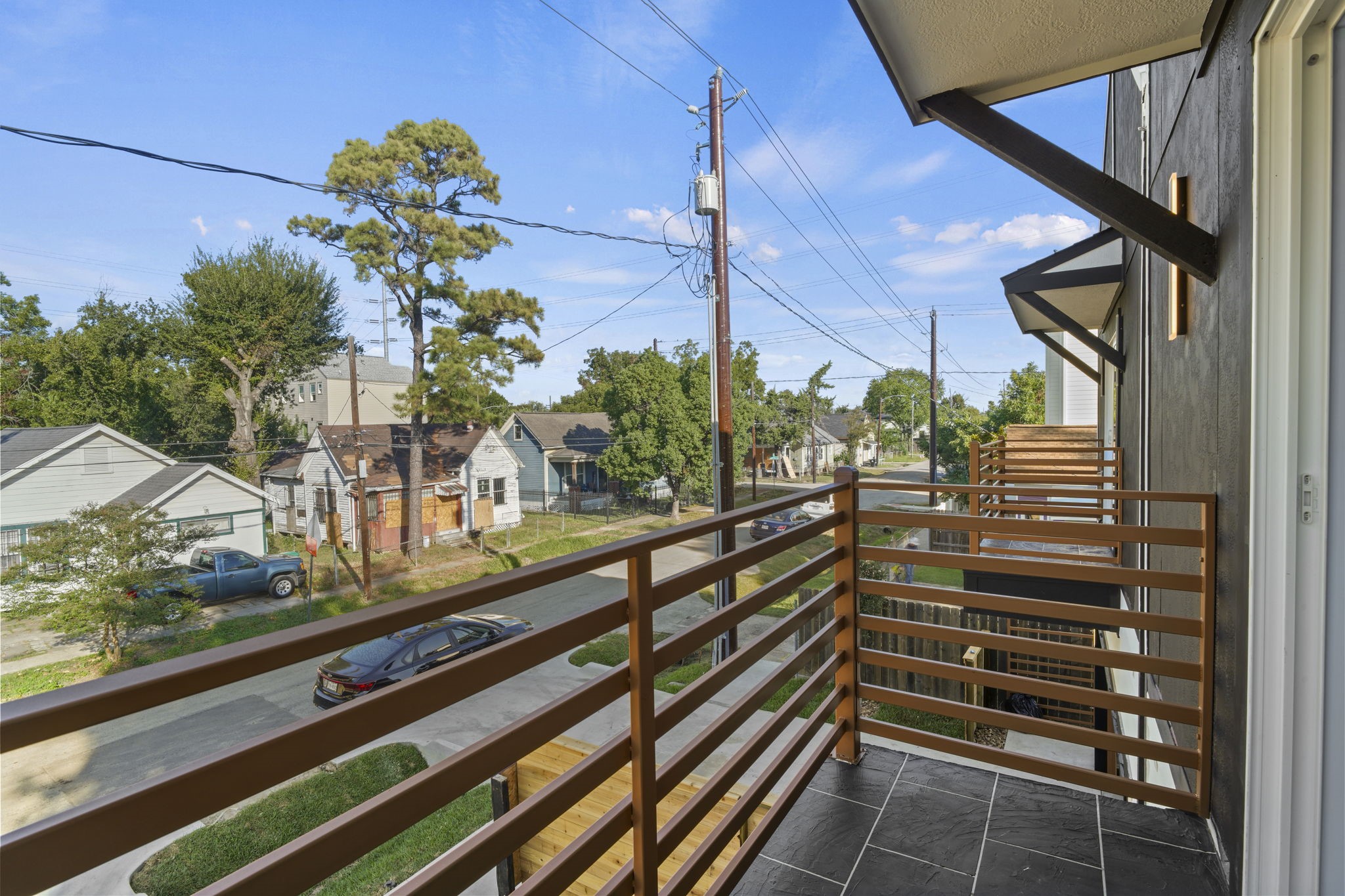 Extending directly from the upper level, this balcony space combines functional design with outdoor relaxation.