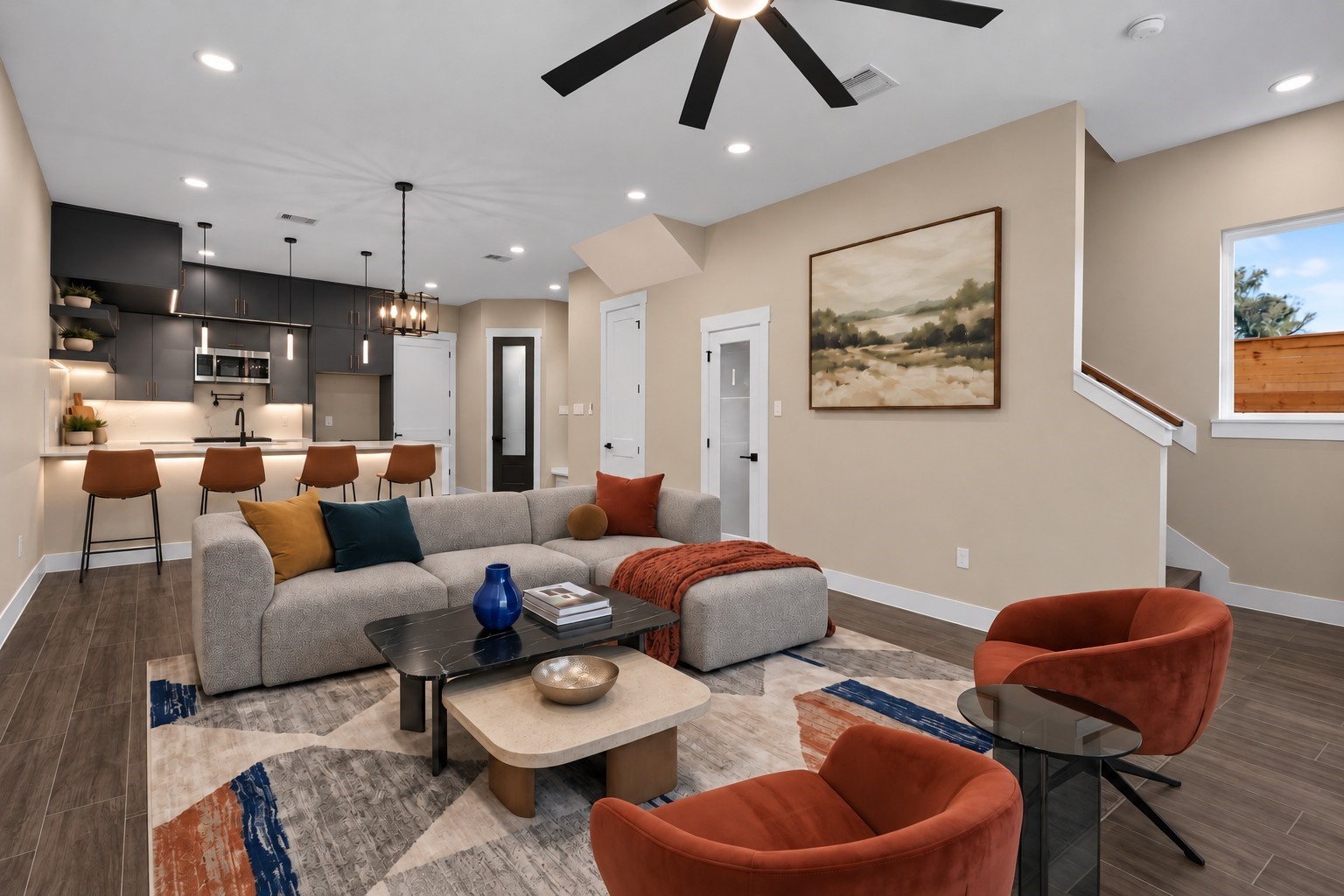Virtually Staged: The expansive layout offers smooth traffic flow between living zones, making it an inviting centerpiece of the home.