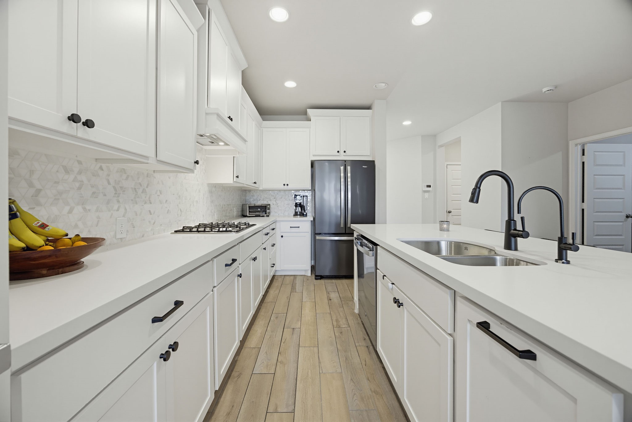 Quartz countertops, stainless steal appliances and gorgeous cabinetry
