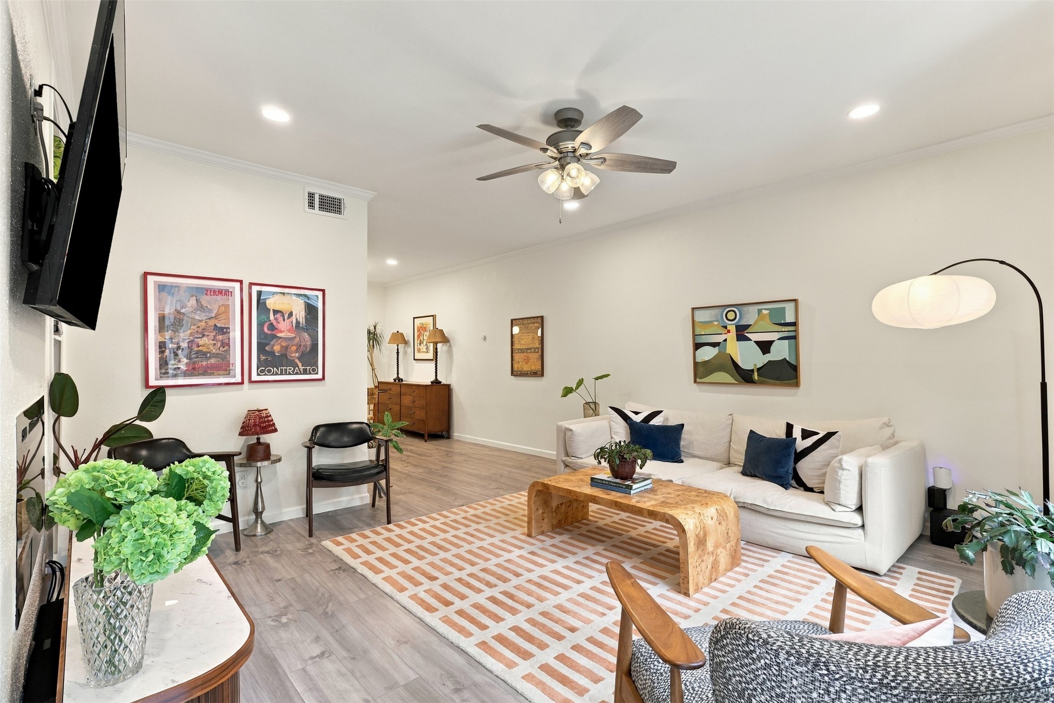 The spacious living room invites you to settle in, with an open flow that makes everyday living feel easy.