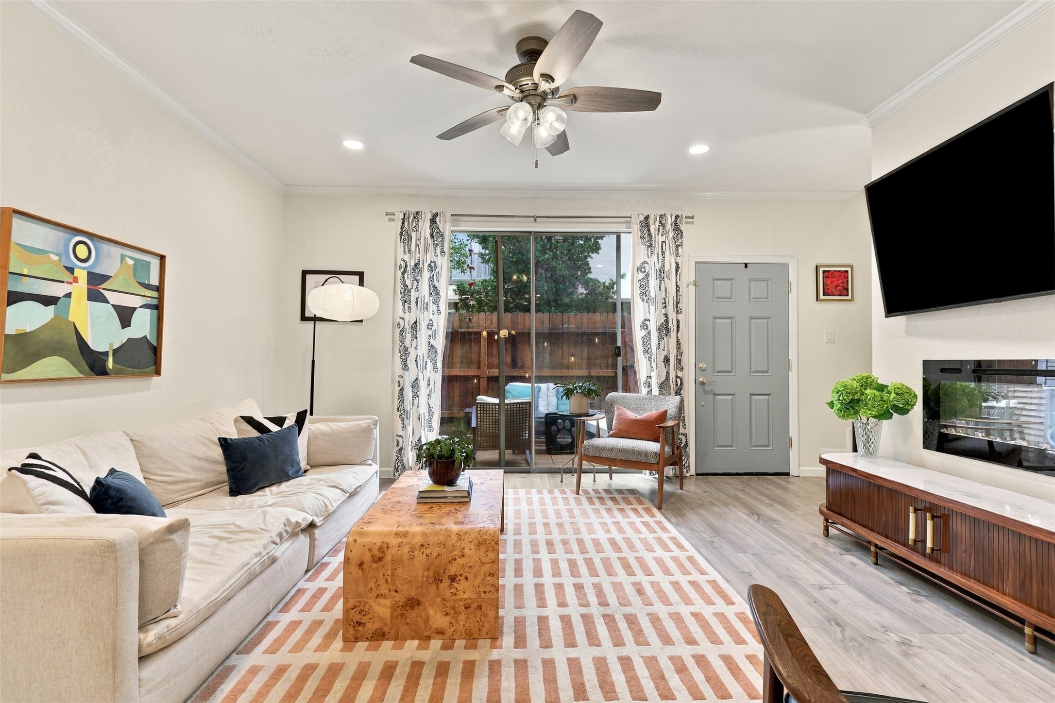 This view shows how naturally the living room extends to the private patio for indoor-outdoor living.