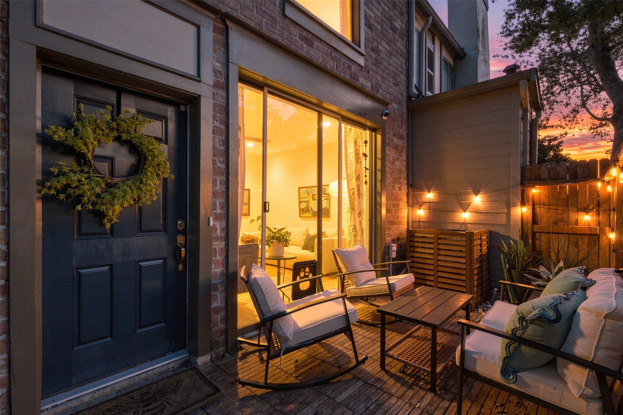 Charming outdoor patio with cozy seating, warm string lights, and a welcoming atmosphere perfect for evening relaxation.