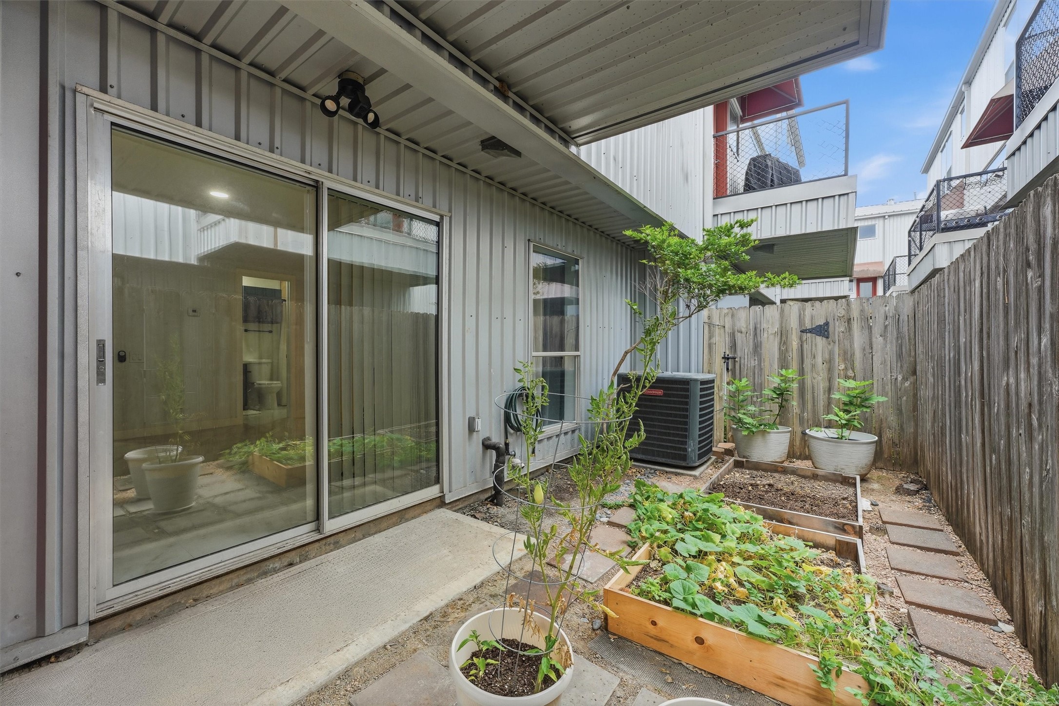 Private first floor patio. Imagine creating your own urban garden here! There's also a small storage room on this level.