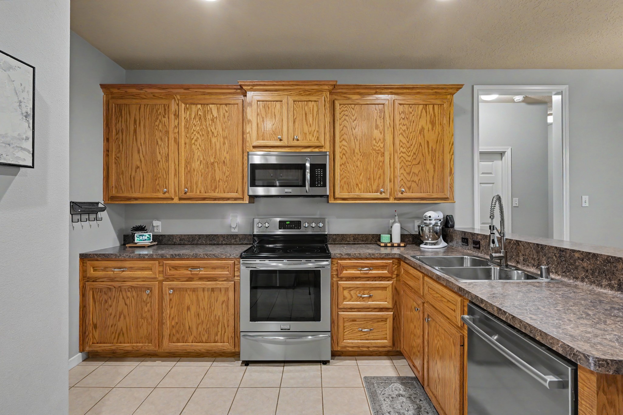 Stainless Appliances and hardwood cabinets