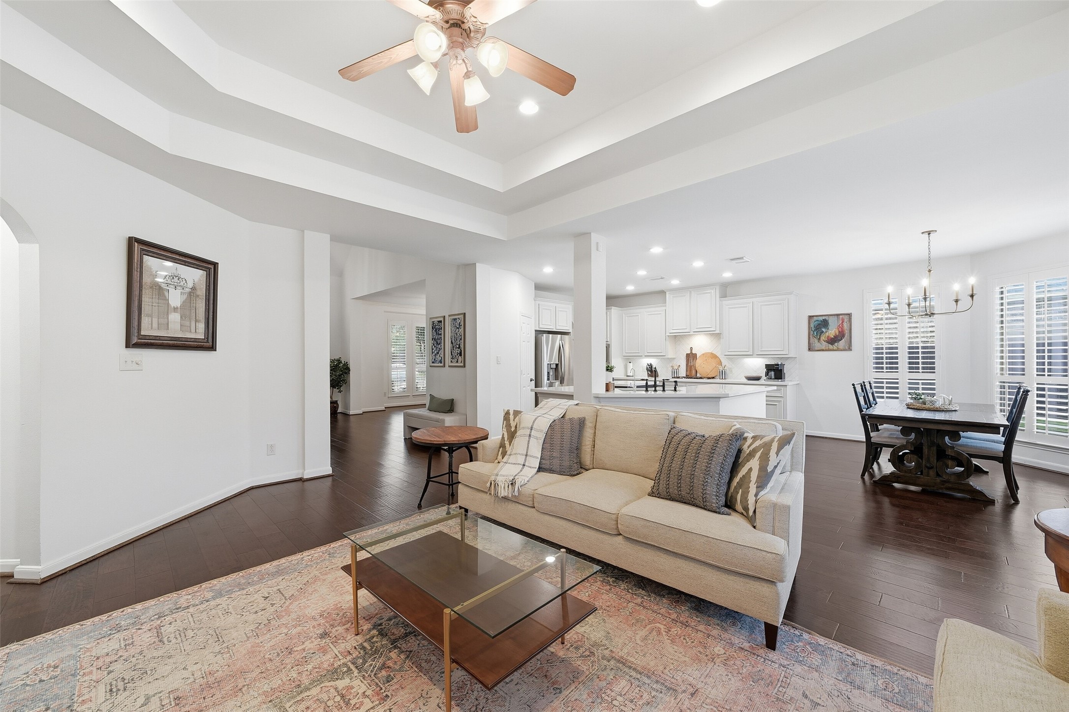 Notice the beautiful tray ceiling and plantation shutters.