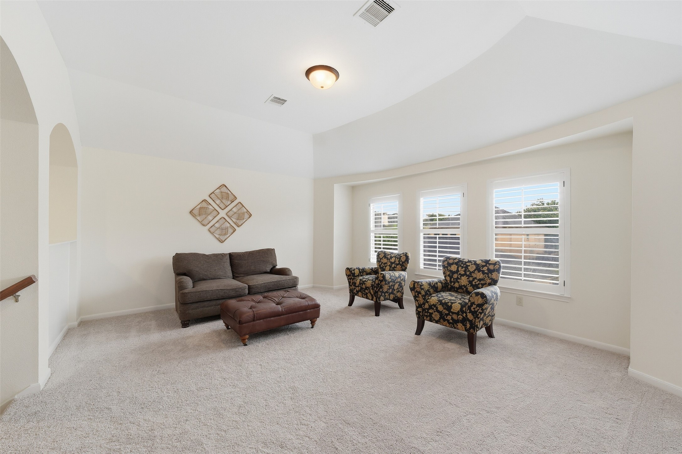 Large game room overlooking the backyard.