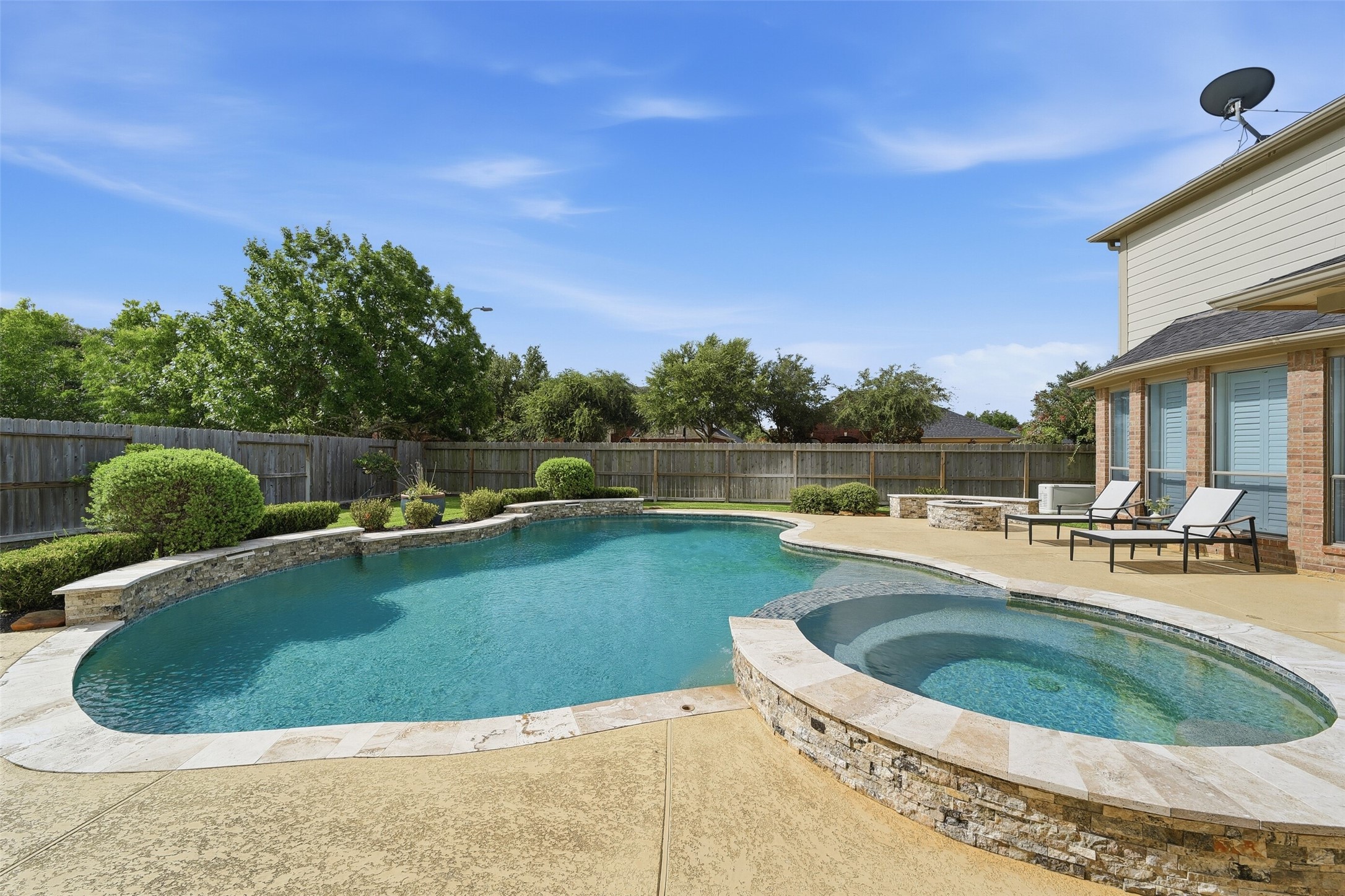 Enjoy spending summer days in the large pool and cooler days in the hot tub. Enjoy spending summer days in the large pool and cooler days in the hot tub.