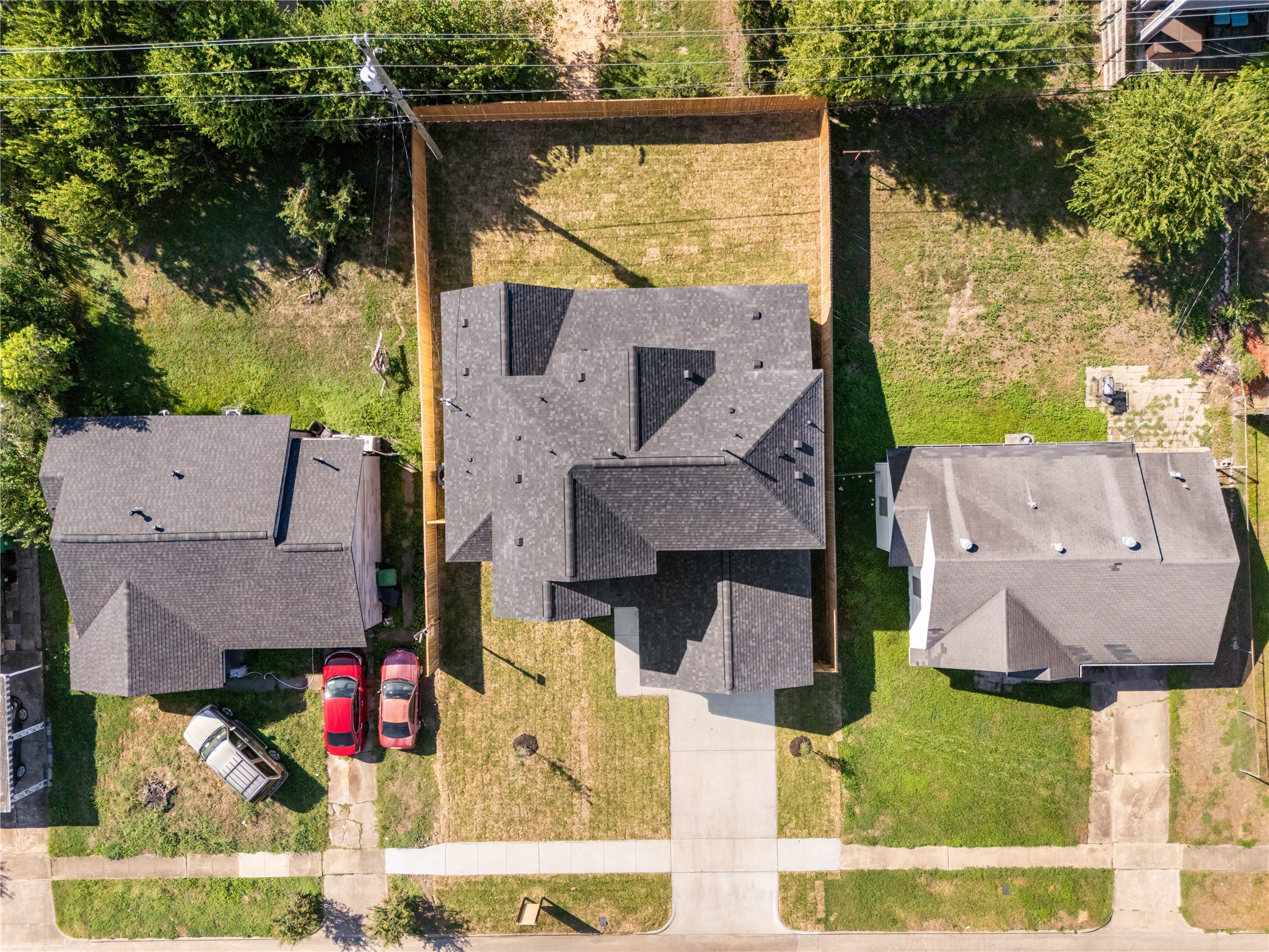 The overhead view showcases the home's footprint, private backyard, and generous separation between the residence and rear property line.