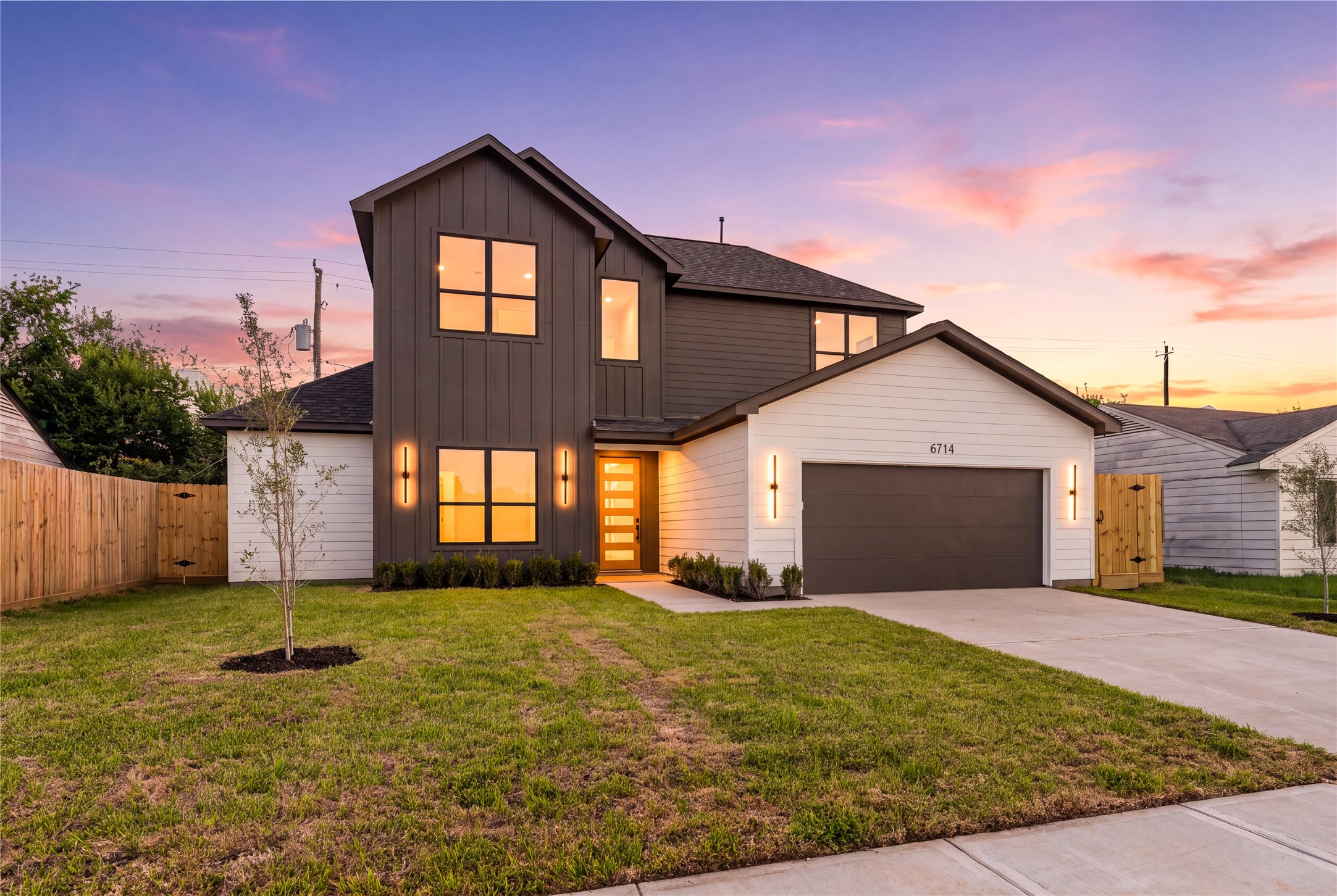 As daylight fades, the home's architectural character takes center stage, offering a fitting conclusion to a residence crafted by Nima Homes.