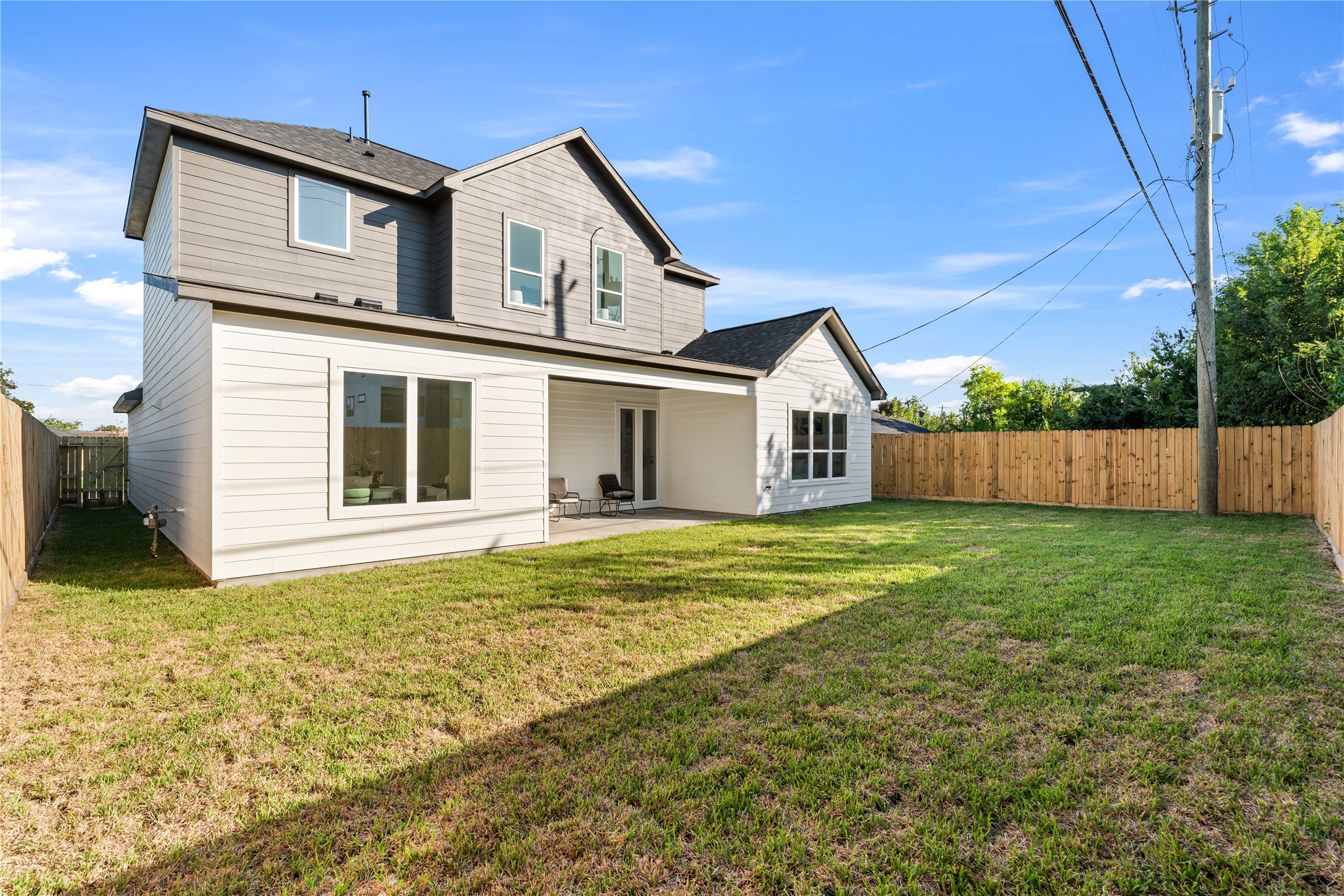 Beyond the home's contemporary exterior lies a spacious backyard with endless possibilities for personalization.