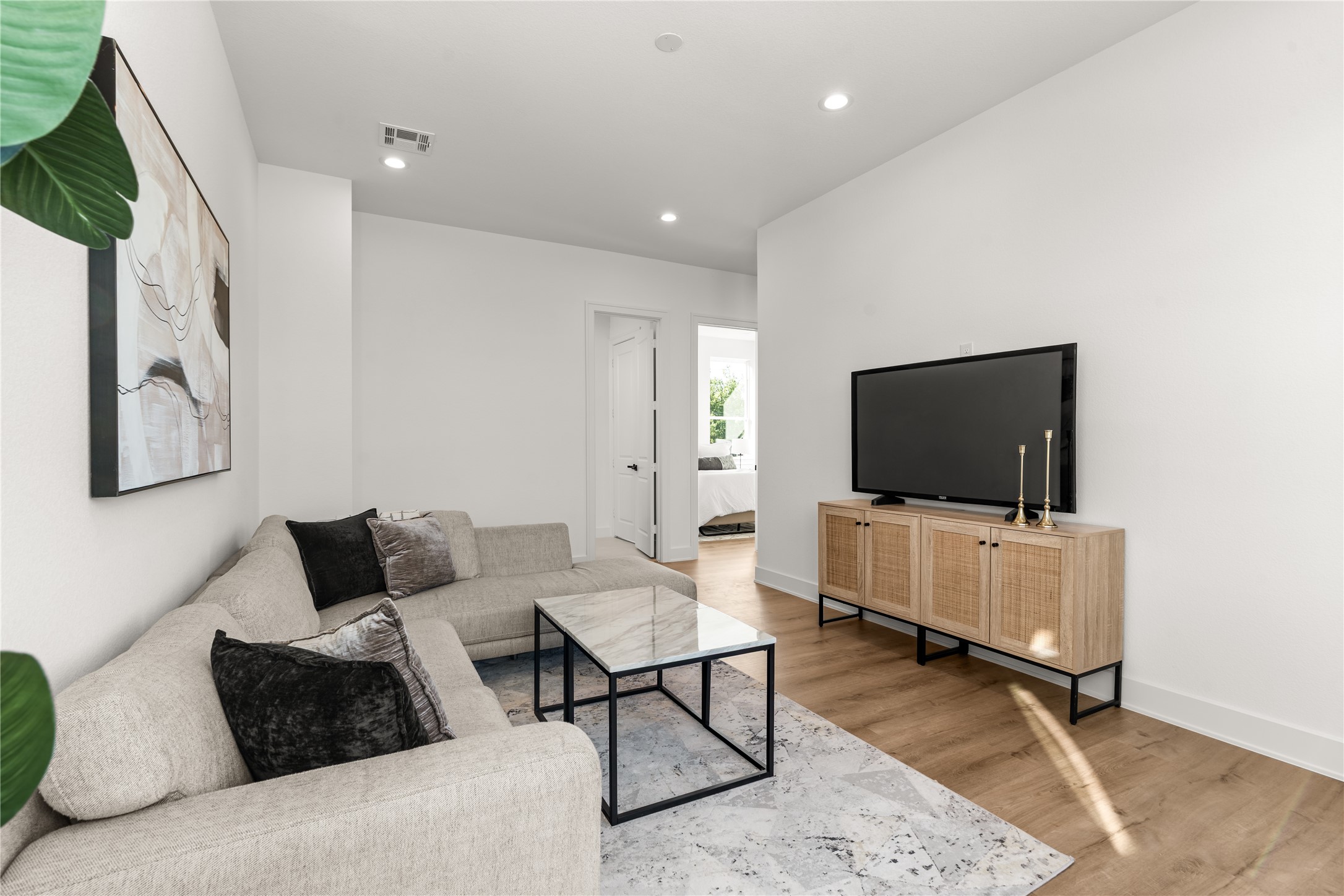 Generous proportions allow for comfortable furnishings, while its proximity to the secondary bedrooms enhances the functionality of the upper level.