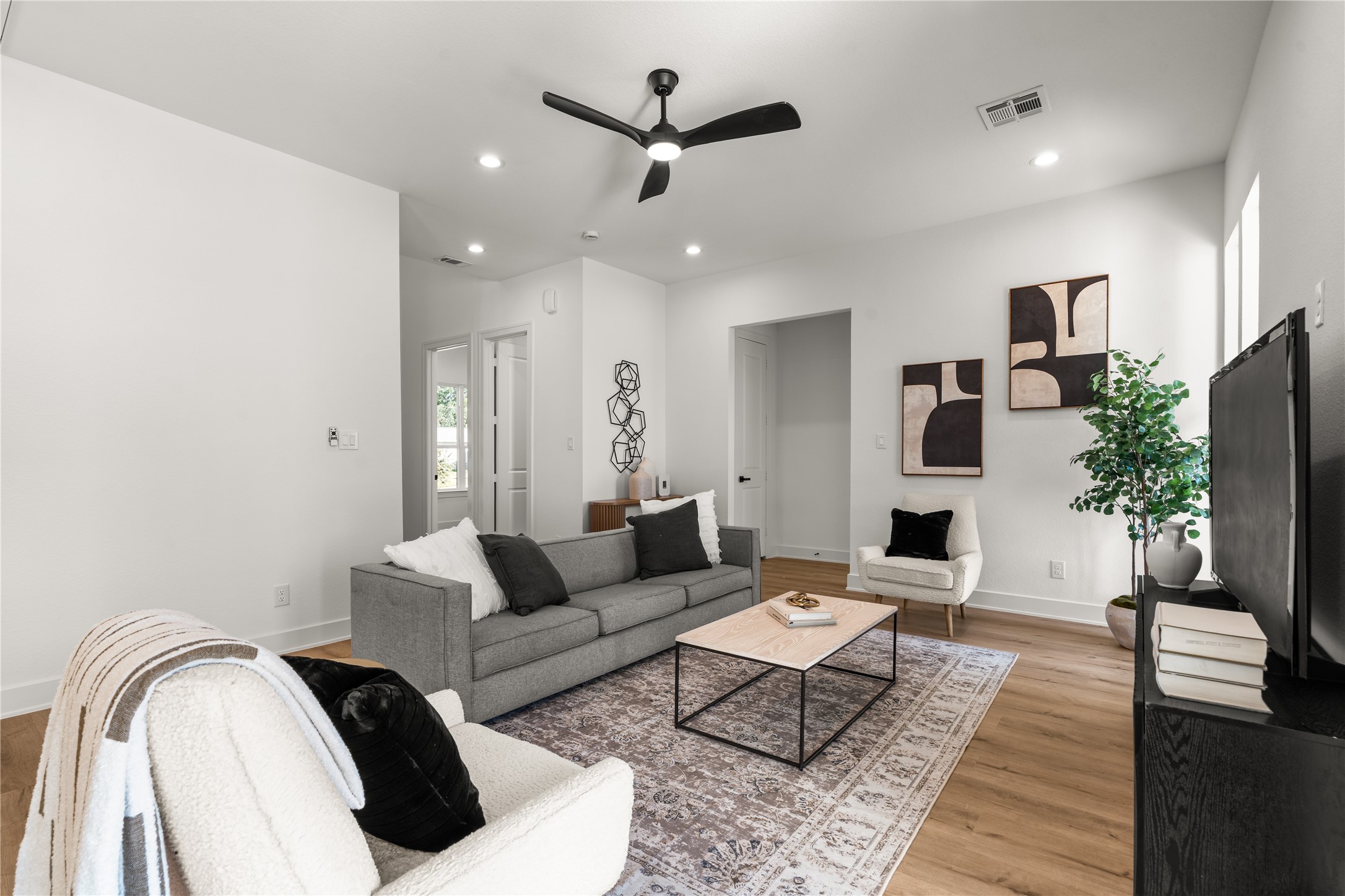 Comfort and versatility define this spacious living area, where an open footprint accommodates intimate evenings as easily as larger gatherings.