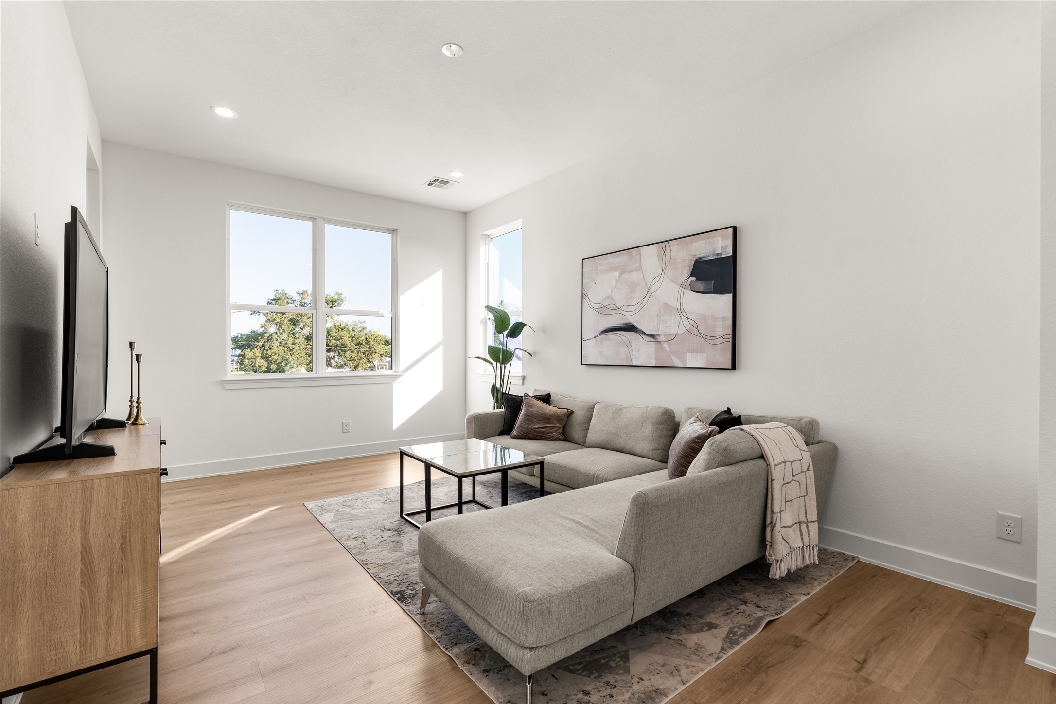 Designed to adapt to changing needs, the upstairs family room offers ample space for a media lounge, game room, or additional entertaining area.
