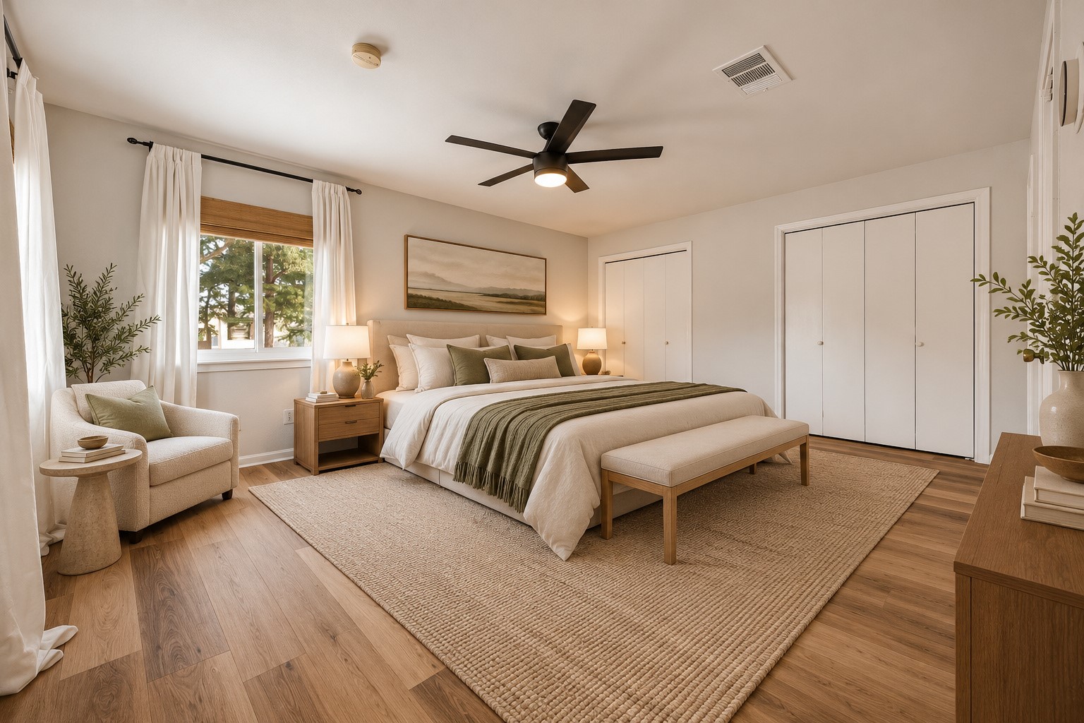virtually staged to show off the generous size of the primary bedroom.