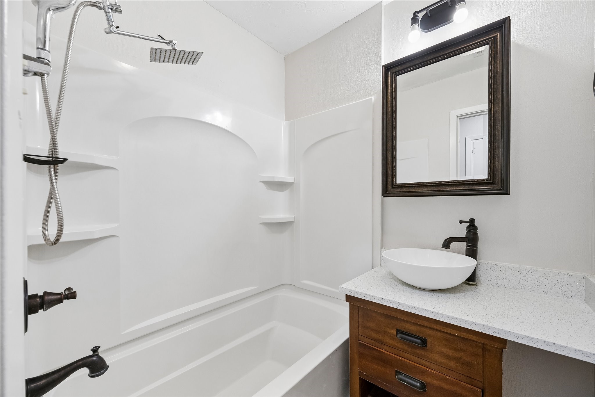 Bathroom 2 features a tub/shower combo and updated vanity area.