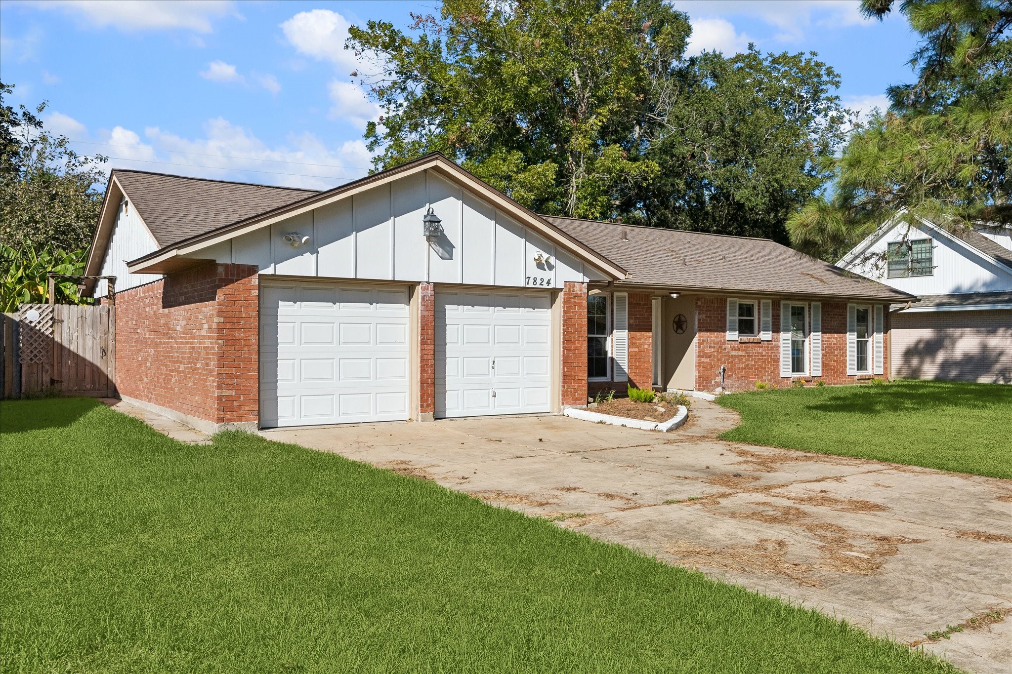 A view of the driveway and garage. Such an inviting home. A view of the driveway and garage. Such an inviting home.