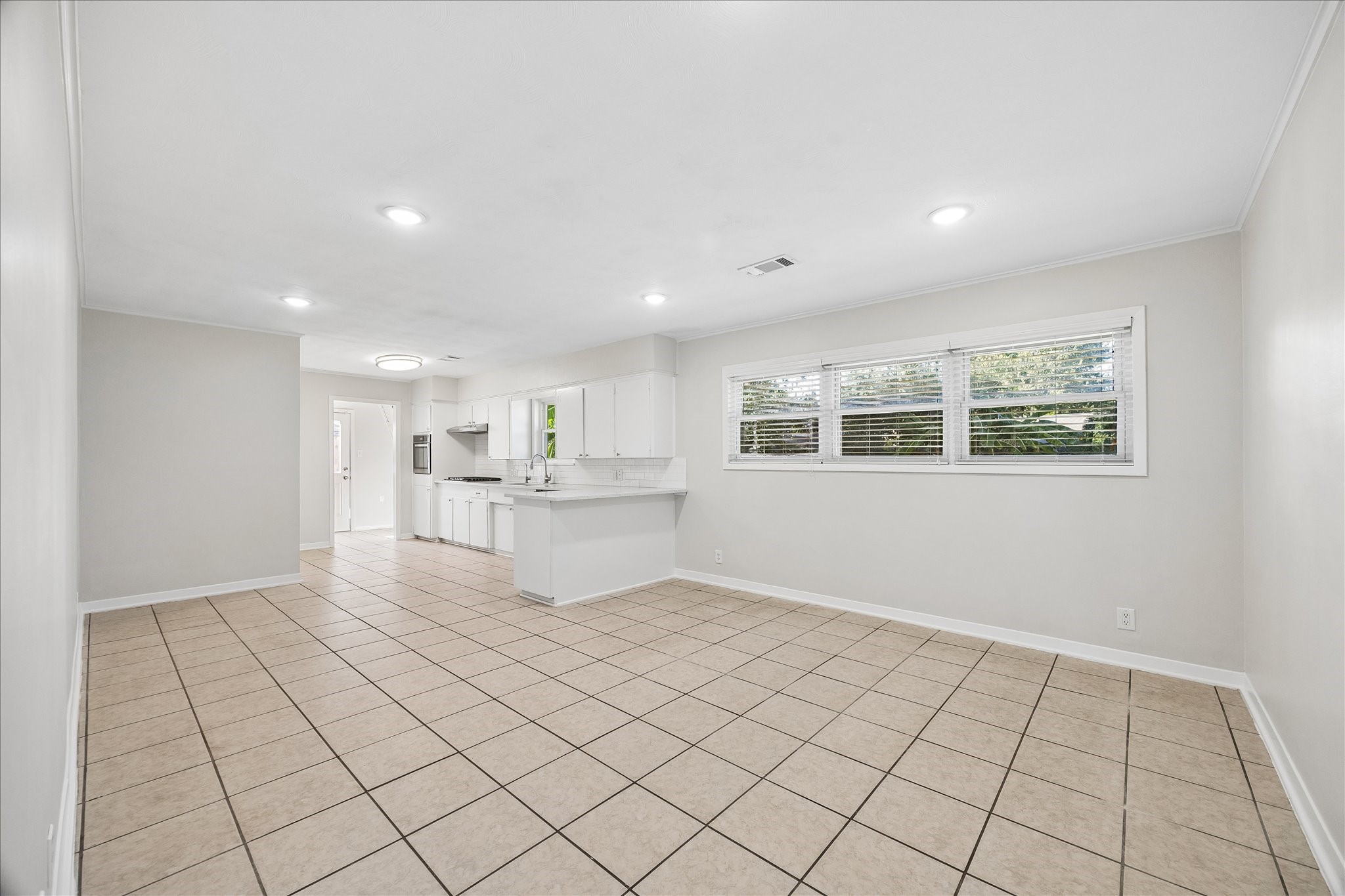 The kitchen is spacious and has endless possibilities. Set up a family gathering area and small breakfast space or a full dining room.
