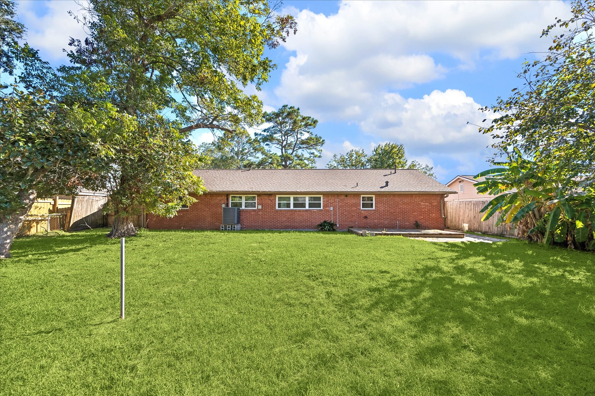 Spacious backyard and the house has brick all the way around. Spacious backyard and the house has brick all the way around.