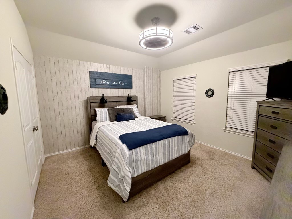 Discover the cozy charm of this inviting 10x13 third bedroom upstairs, perfect for comfort.