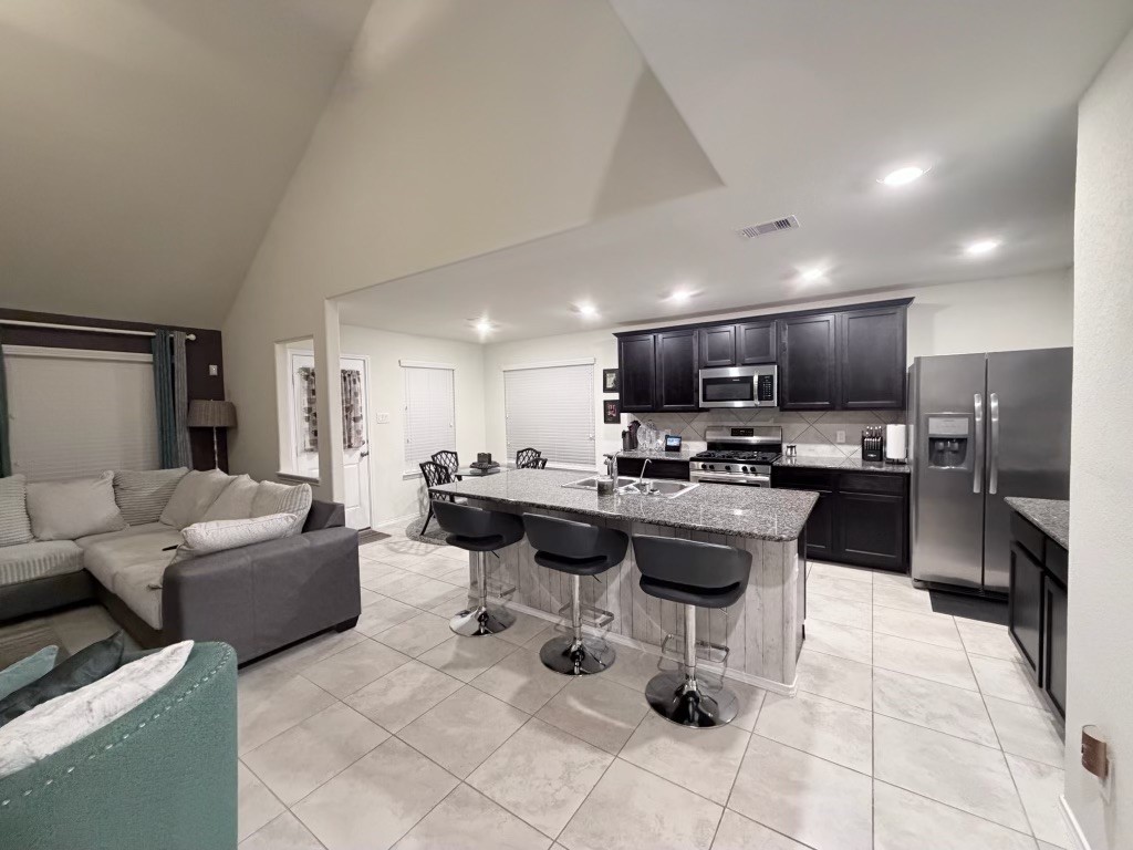 Discover the perfect smart home that has a open entertaining space in this inviting home, featuring a stylish kitchen with sleek countertops and a spacious living area ideal for gatherings. Discover the perfect smart home that has a open entertaining space in this inviting home, featuring a stylish kitchen with sleek countertops and a spacious living area ideal for gatherings.