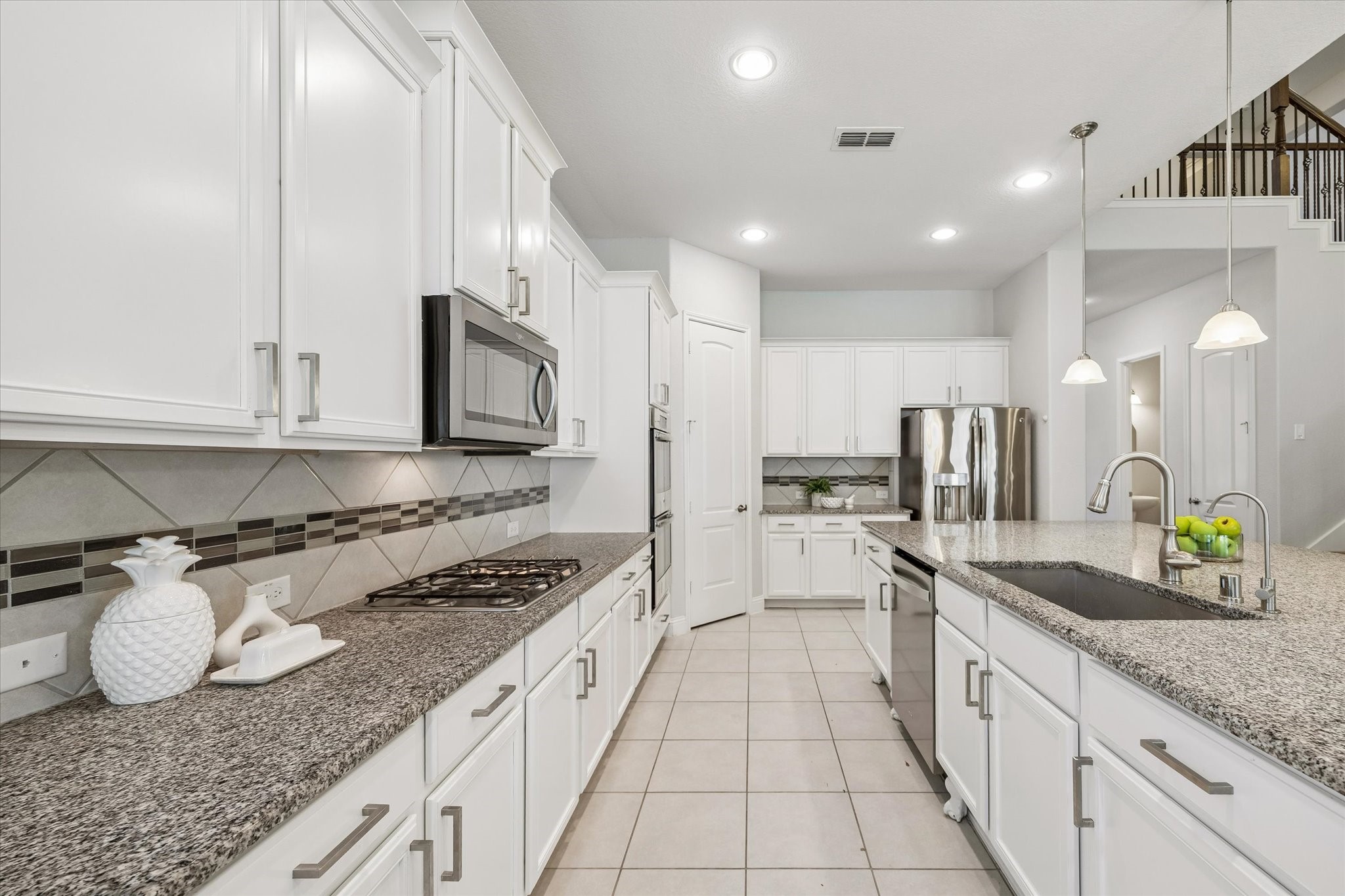 Kitchen Workspace  Functional kitchen with extensive counter space and storage