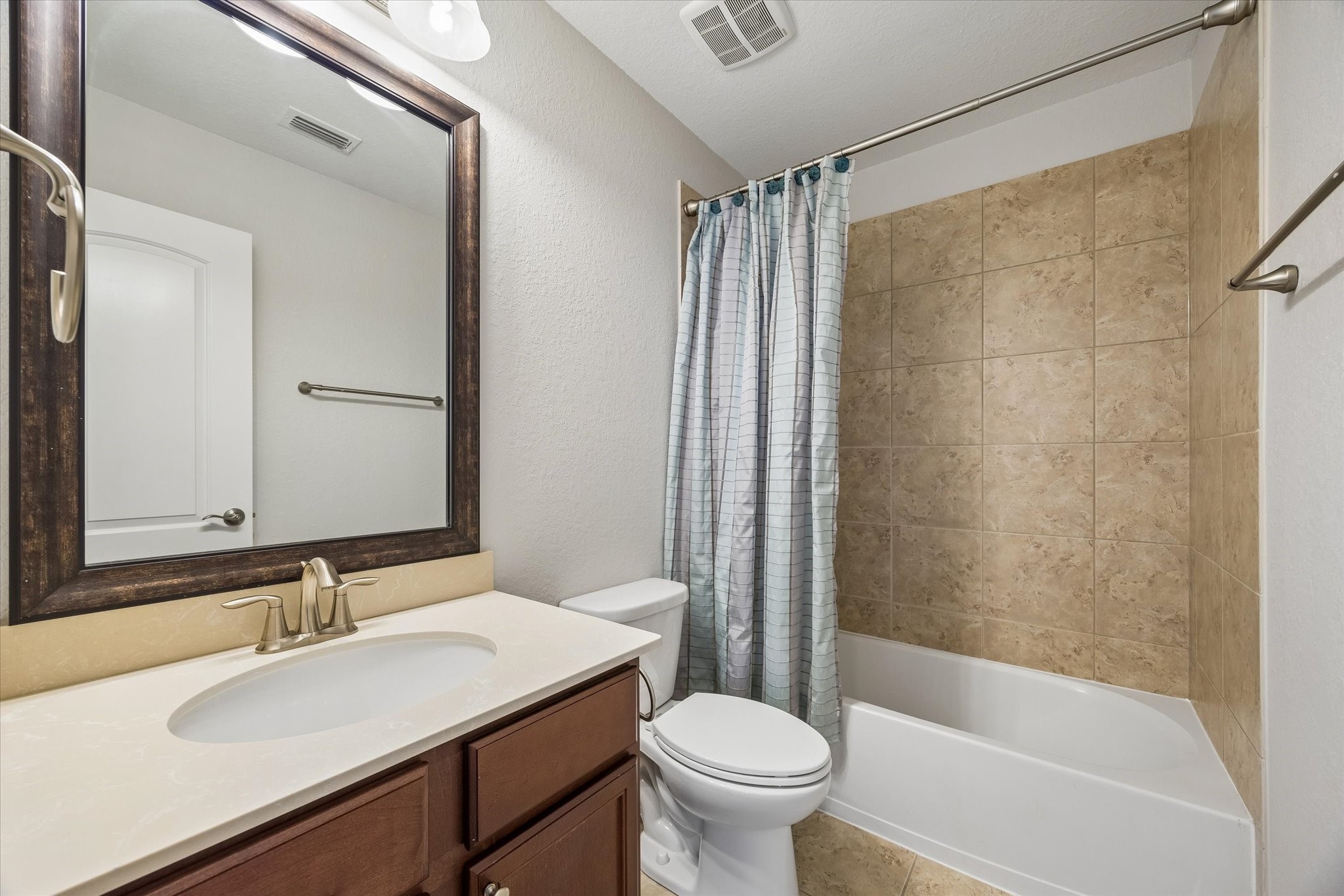 Full bathroom conveniently serving the secondary bedrooms