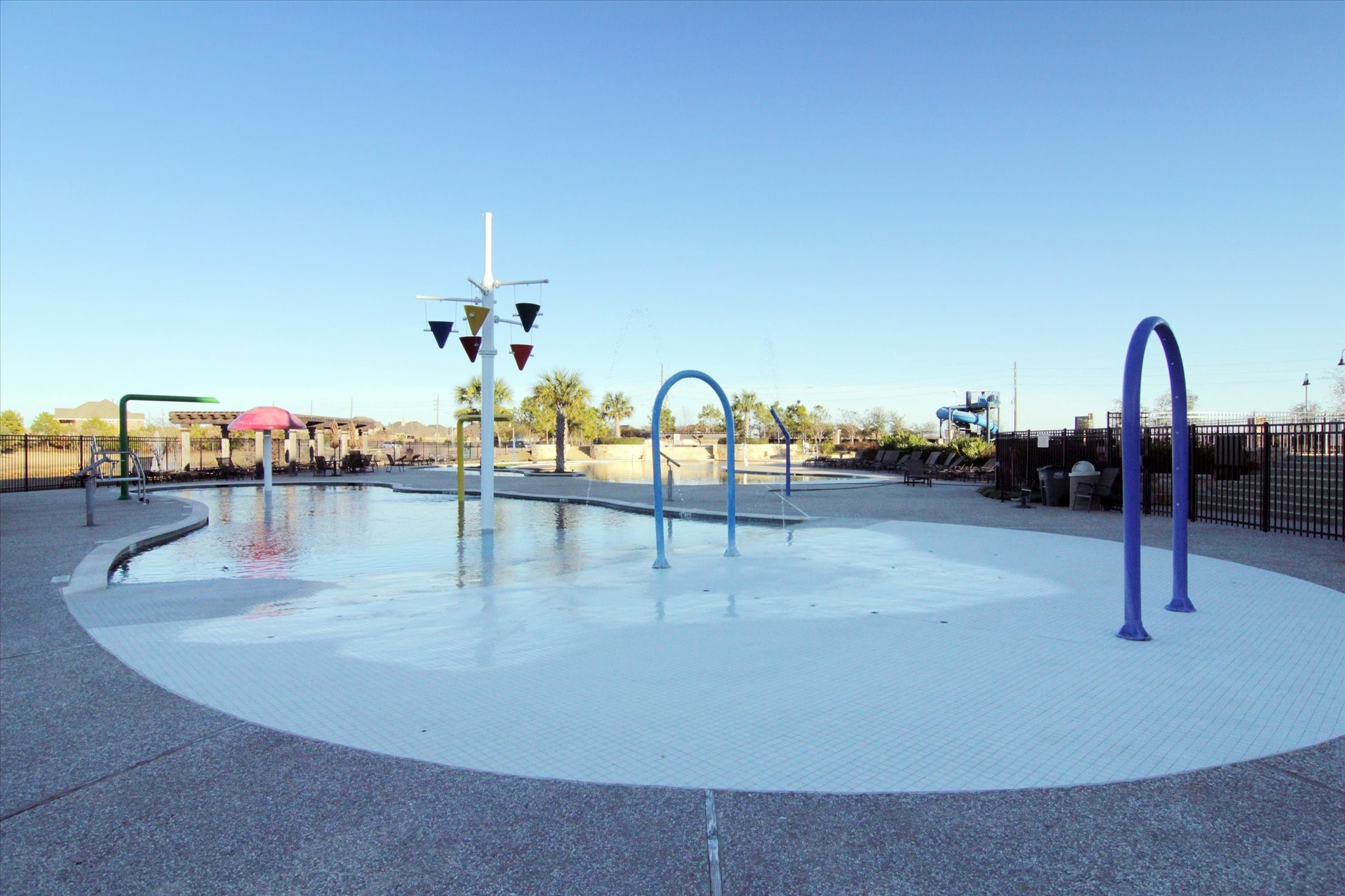 Resort-Style Splash Pad  Fun-filled splash pad perfect for cooling off on warm Texas days