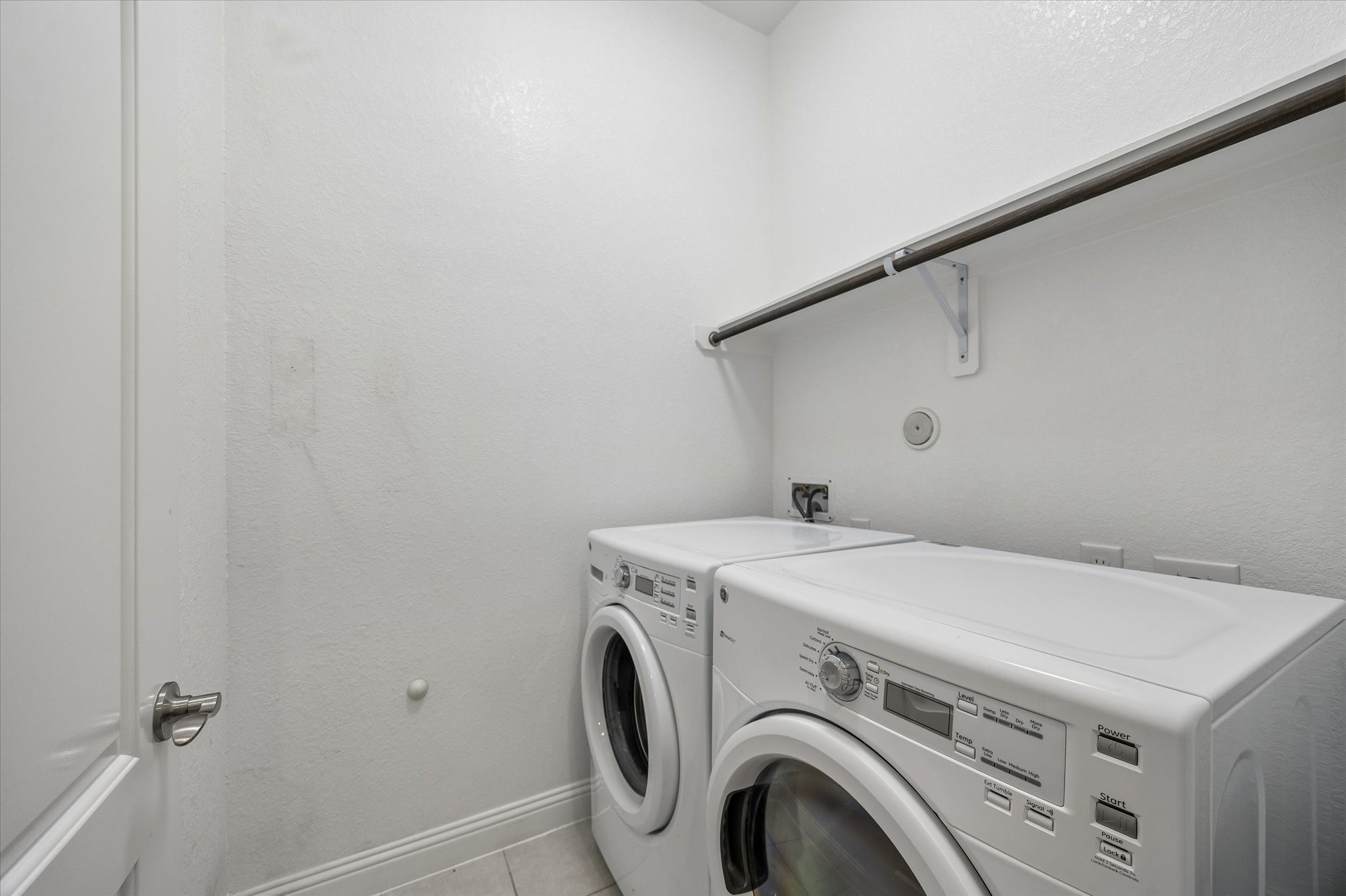 Dedicated laundry room with washer and dryer