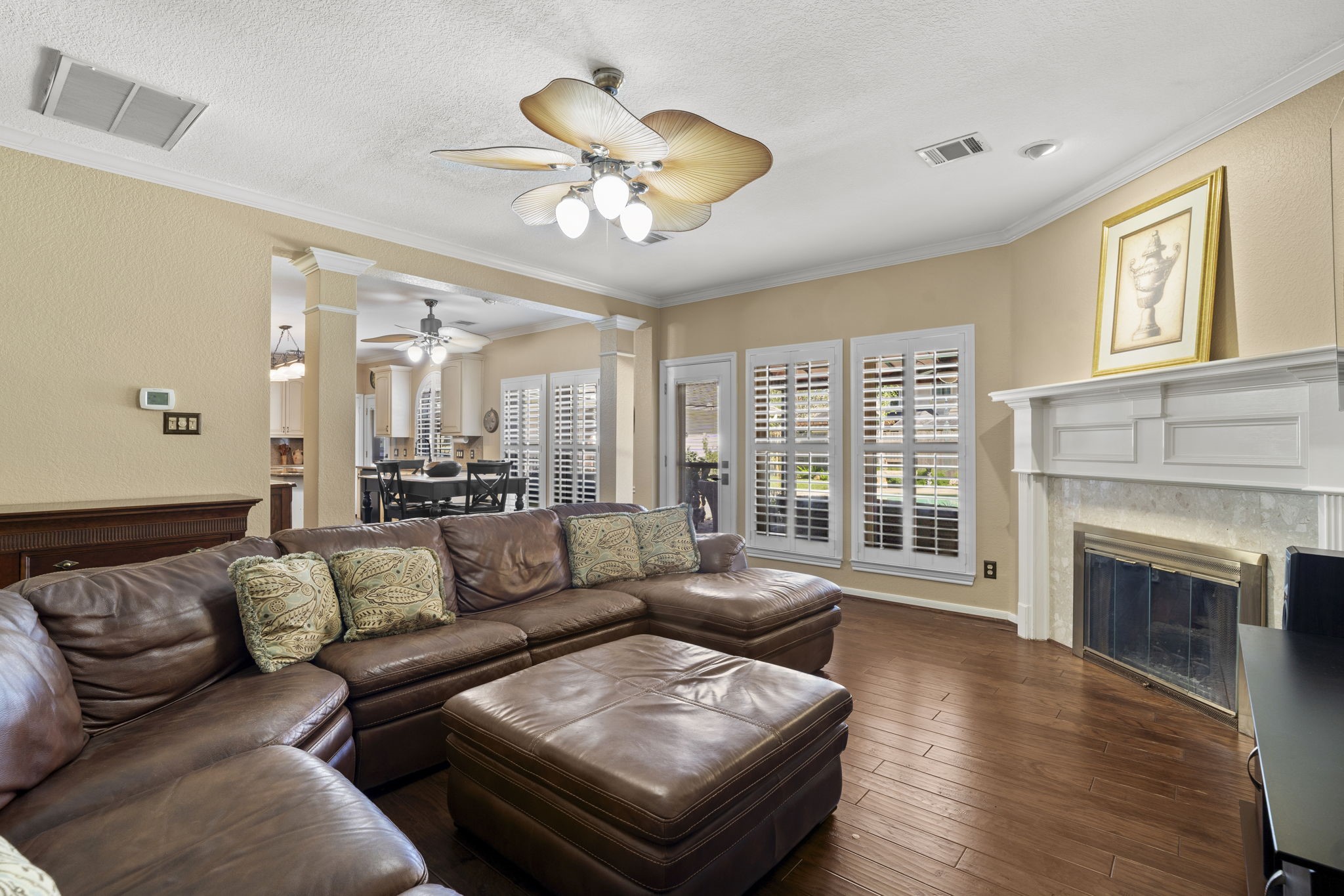 Relax by the fireplace in the inviting family room, ideally situated near the kitchen and breakfast area, with direct access to the patio and pool.