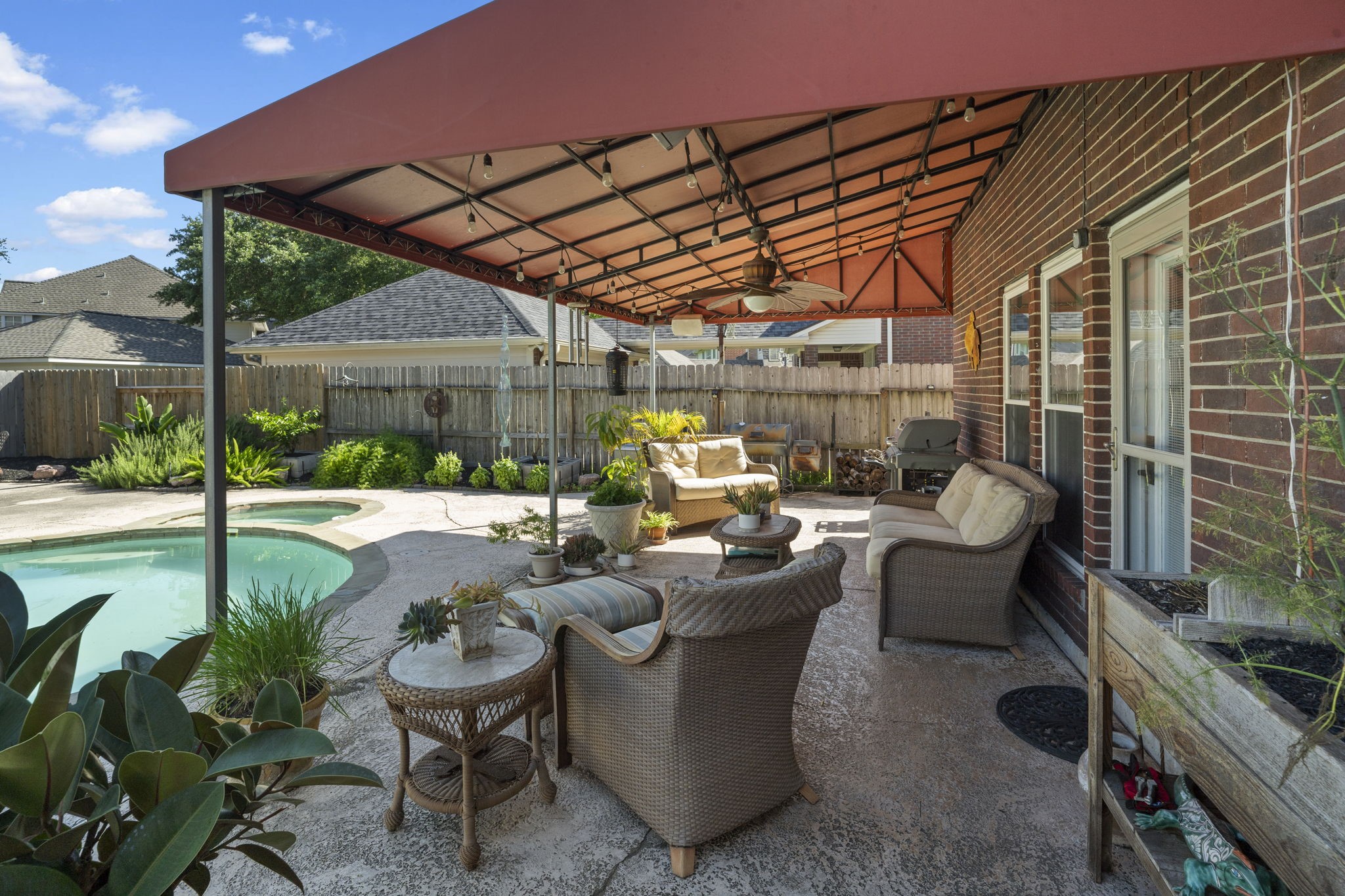 An awning provides welcome shade and relief from the intense Texas sun, creating a comfortable space to relax outdoors even on the hottest summer days.