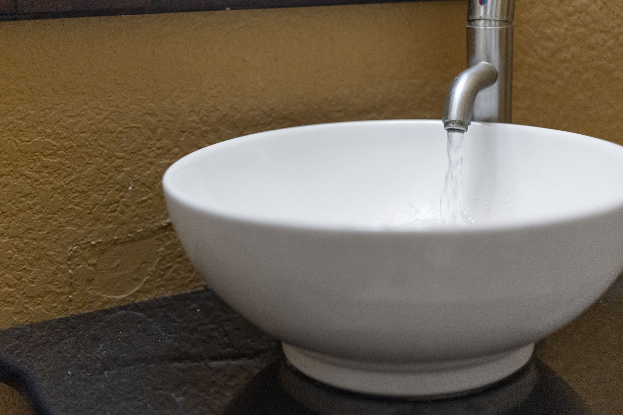 A stylish vessel sink adds a modern and elegant touch.