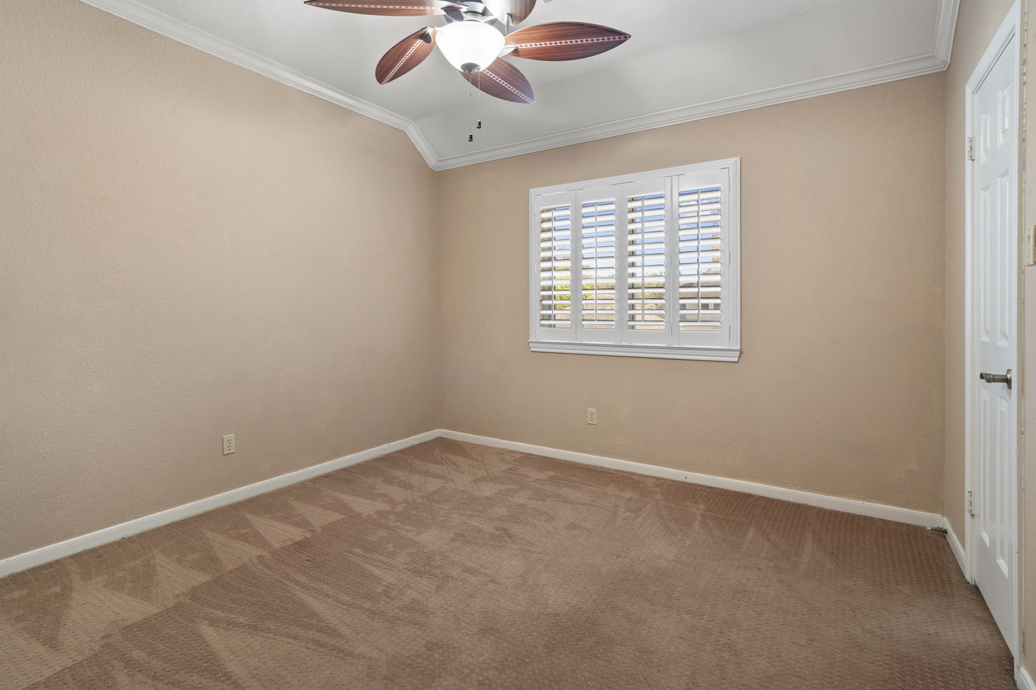 Three additional bedrooms are located upstairs, each offering a walk-in closet and a lighted ceiling fan.