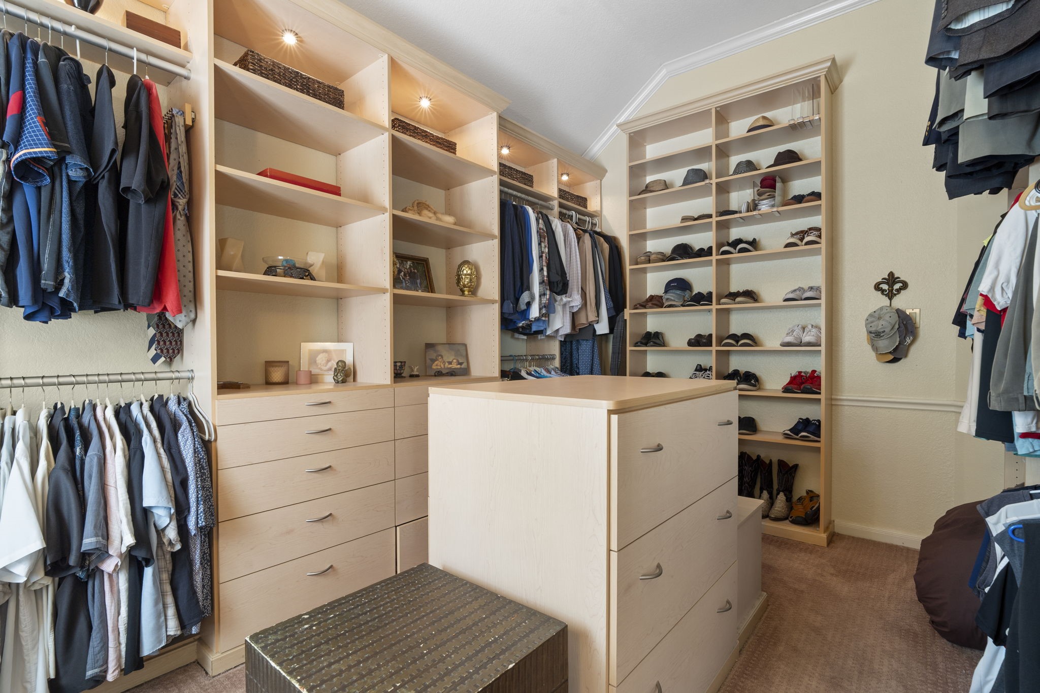 This is the third and largest closet in the owners suite (11' x 15'), featuring a custom California Closets built-in organization system for exceptional storage and organization.
