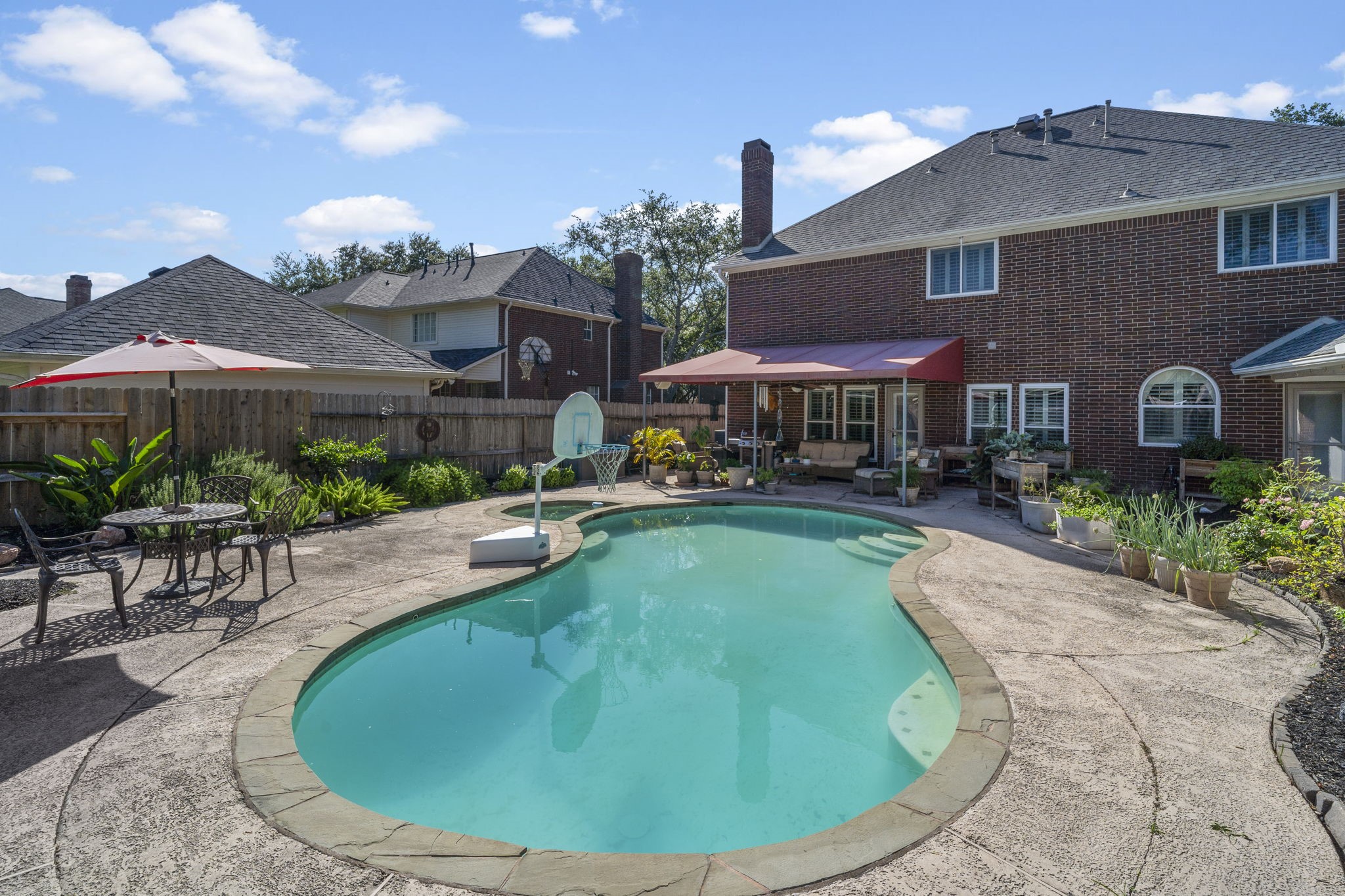 Friends and family will love gathering for a refreshing swim and relaxing poolside, making it the perfect setting for entertaining and summer enjoyment.