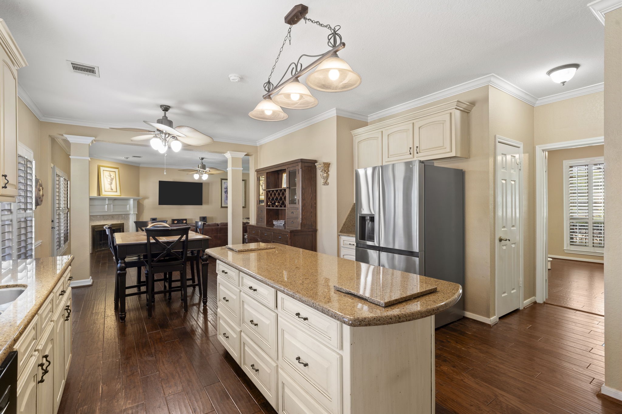 This view highlights the seamless connection between the kitchen and dining room, creating an ideal layout for effortless entertaining and easy flow when hosting guests.
