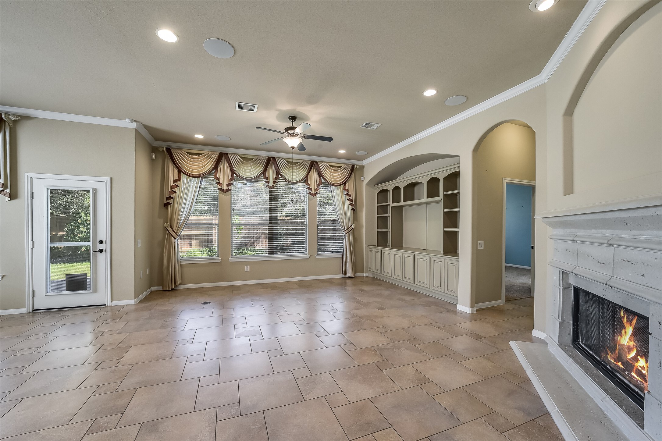 Family room is a spacious area for relaxing and entertaining. Convenient floor plug added. Flush mount ceiling speakers and recessed lighting.