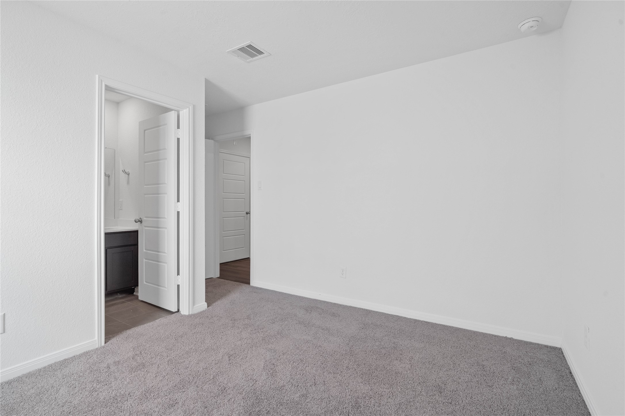 Additional view of guest suite looking towards the ensuite bathroom.