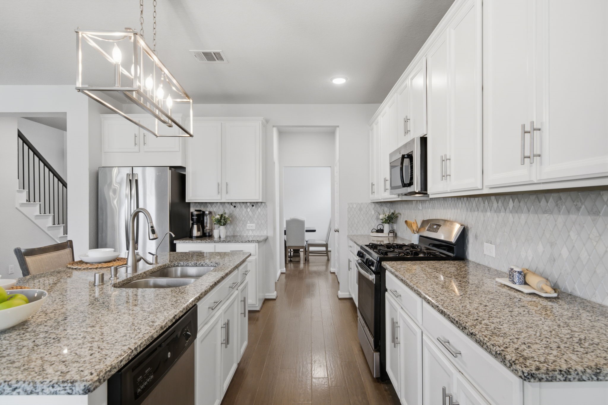 The kitchen features a kitchen island with a breakfast bar, which is great for perfect seating. The kitchen features a kitchen island with a breakfast bar, which is great for perfect seating.