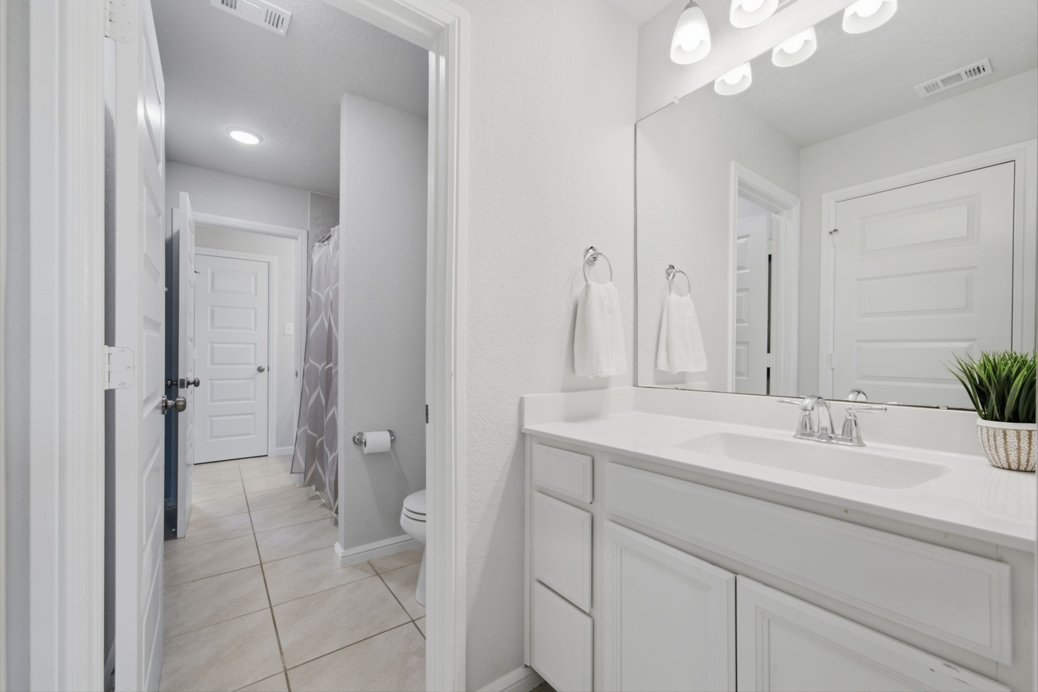 This vanity area is located directly inside of Bedroom #4.