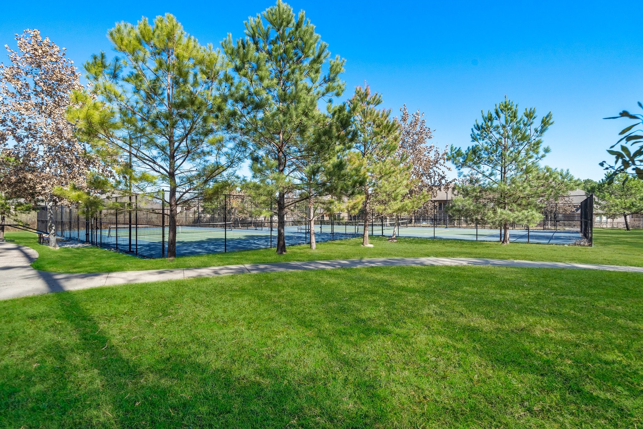 Community tennis/pickle ball courts.