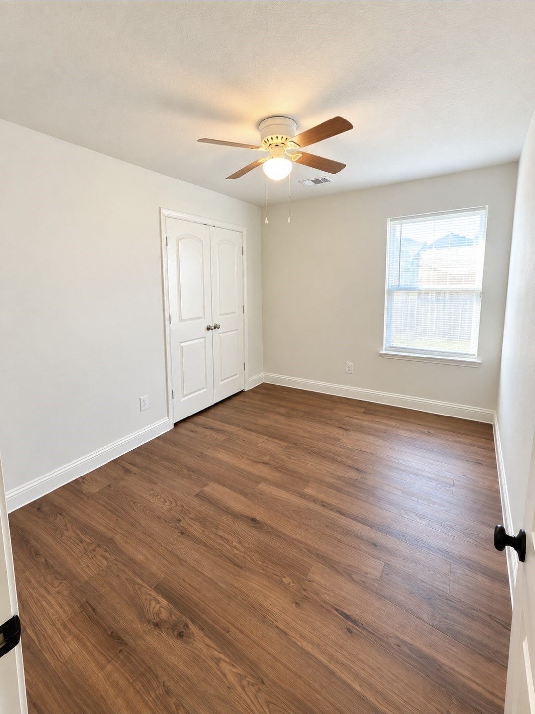 Bedroom #3 with brand-new luxury vinyl plank flooring