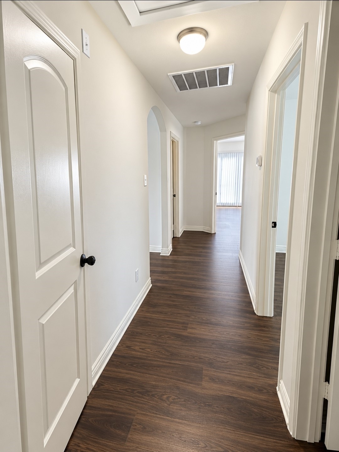 Hallway from the main living area to the bedrooms and hall bath