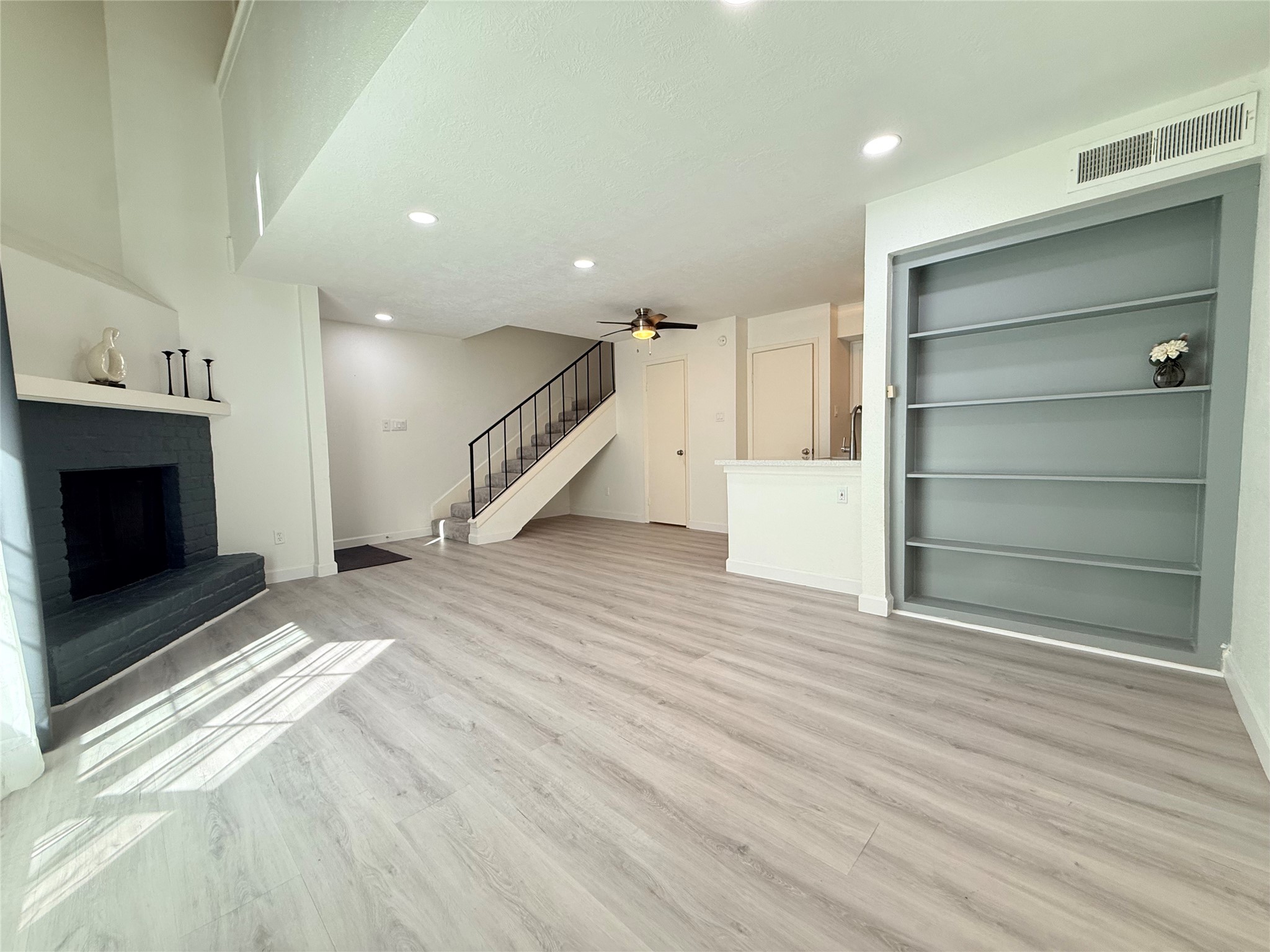 Notice the bookshelves with tons of space for your books, photos and special items!
