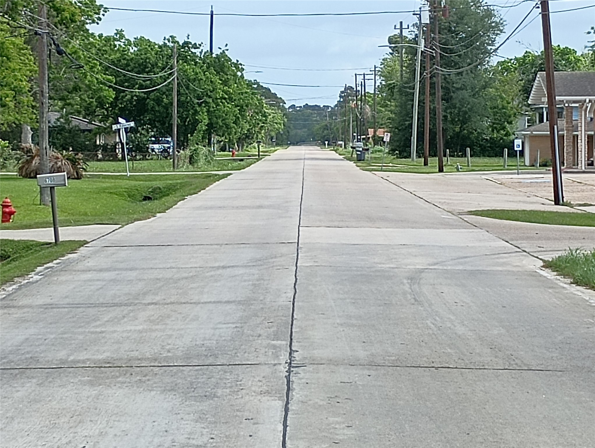 The lot on Fairwood Road is in walking distance to the church on the right. Fairwood Road is a concrete road, well maintained in really good condition.