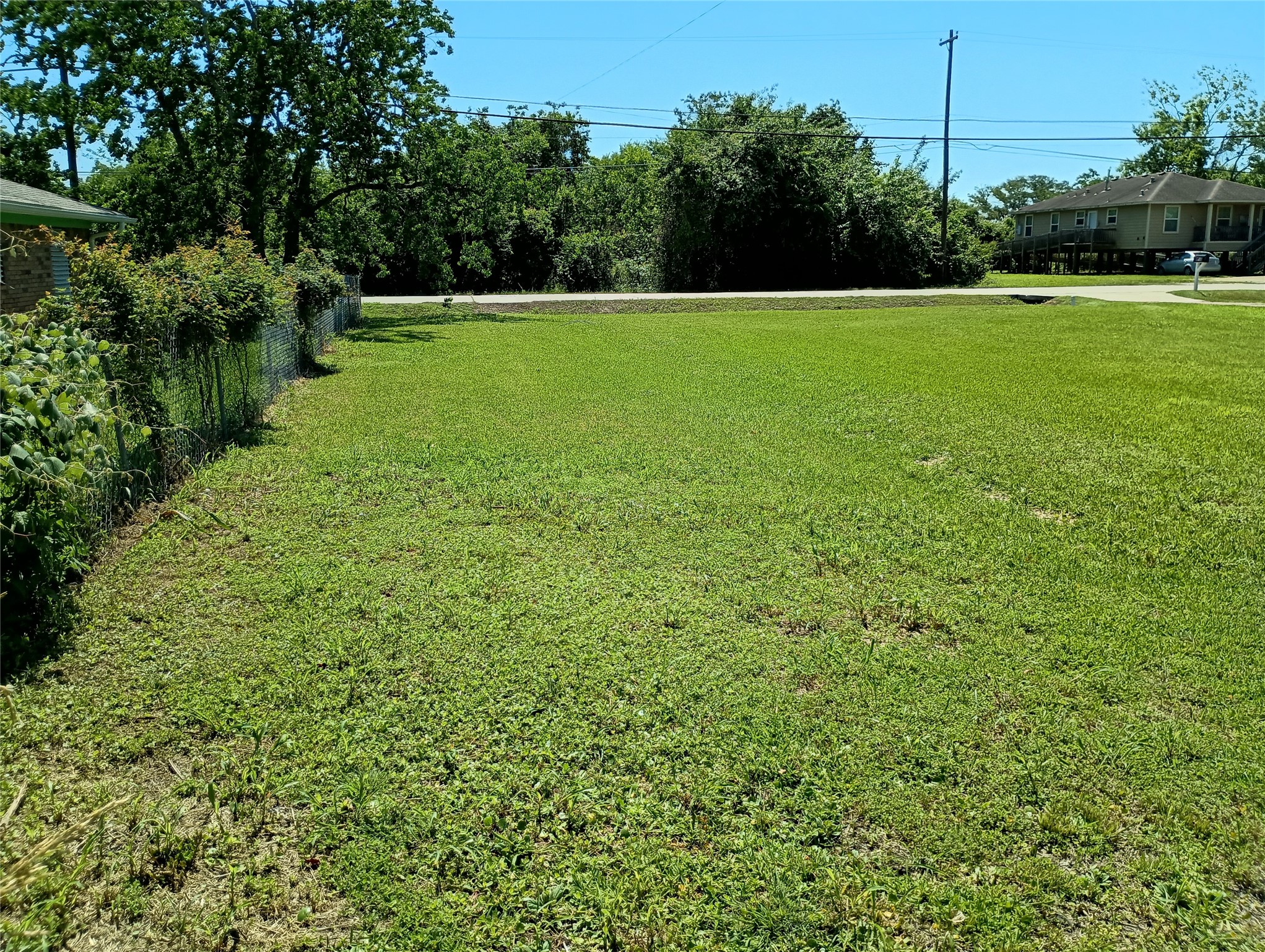 The left side back corner of the lot facing Fairwood Road.