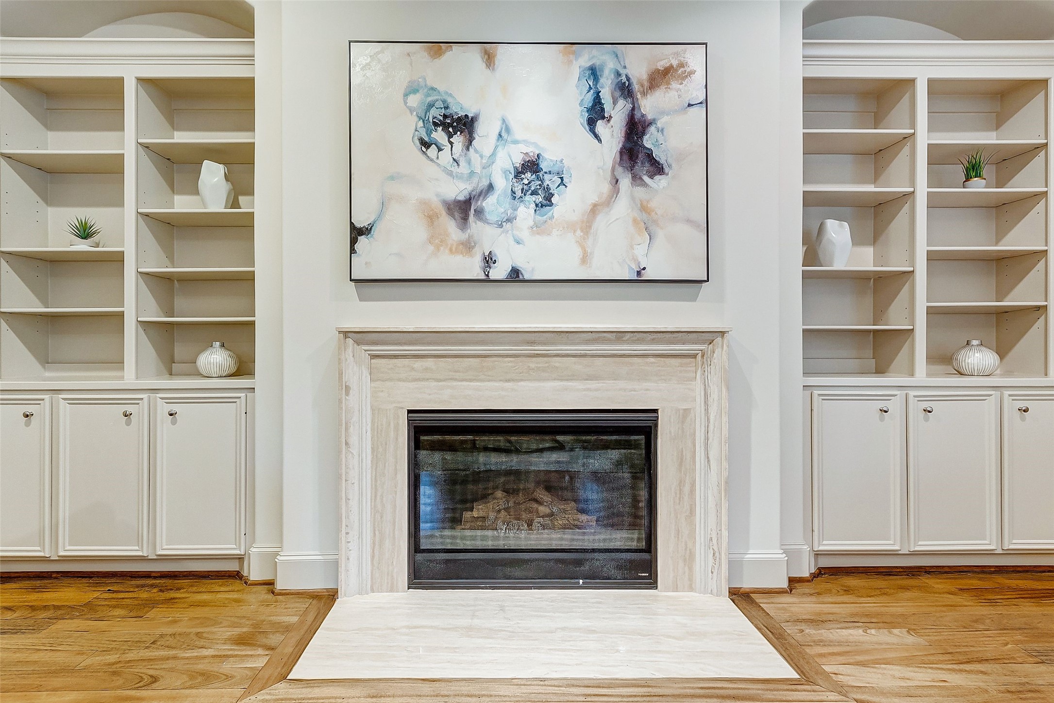 The elegant gas fireplace on the second floor serves as a captivating focal point, infusing the living area with warmth and inviting comfort.