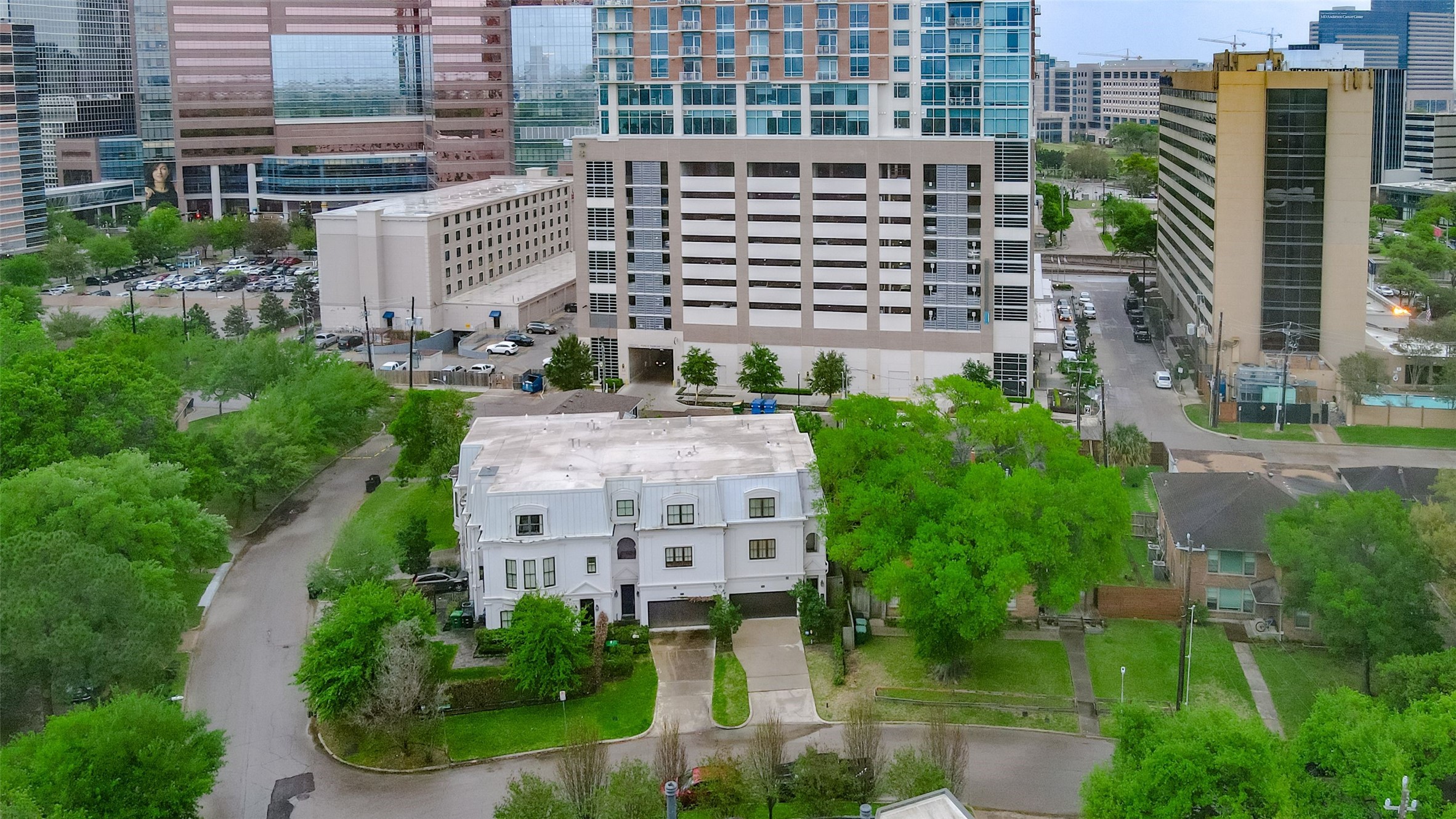 Nestled in the heart of the city, this charming two-story home offers a unique blend of classic architecture and modern convenience, surrounded by lush greenery and urban amenities.