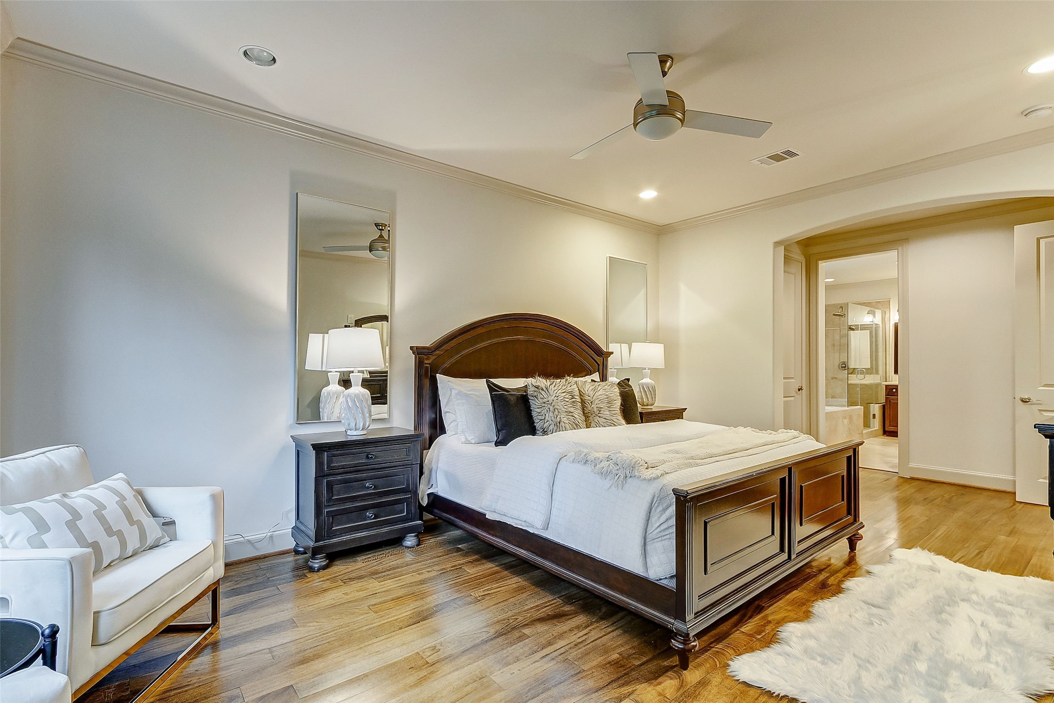 Experience the spacious elegance of the primary bedroom, perfectly designed to include a cozy sitting area for ultimate relaxation.