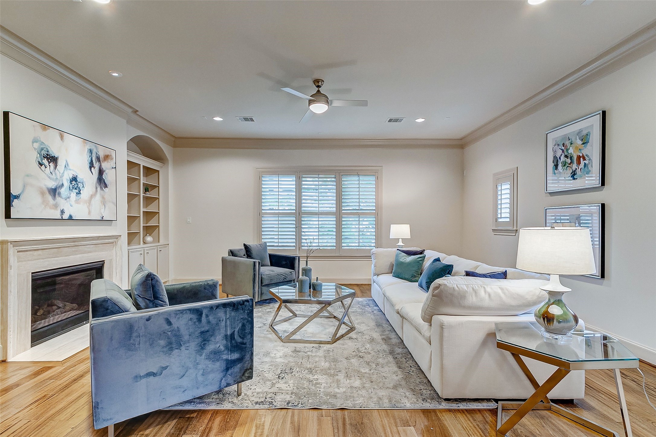 Experience the charm of this second-floor living area, where beautiful wood floors and abundant windows fill the space with natural light.